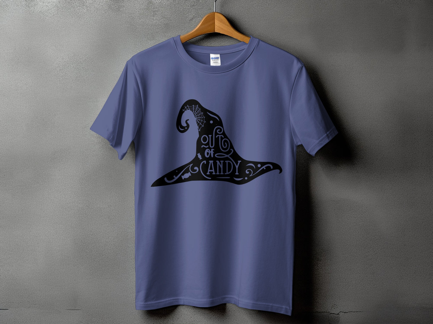 Purple t-shirt with black witch hat graphic that reads "out of candy".