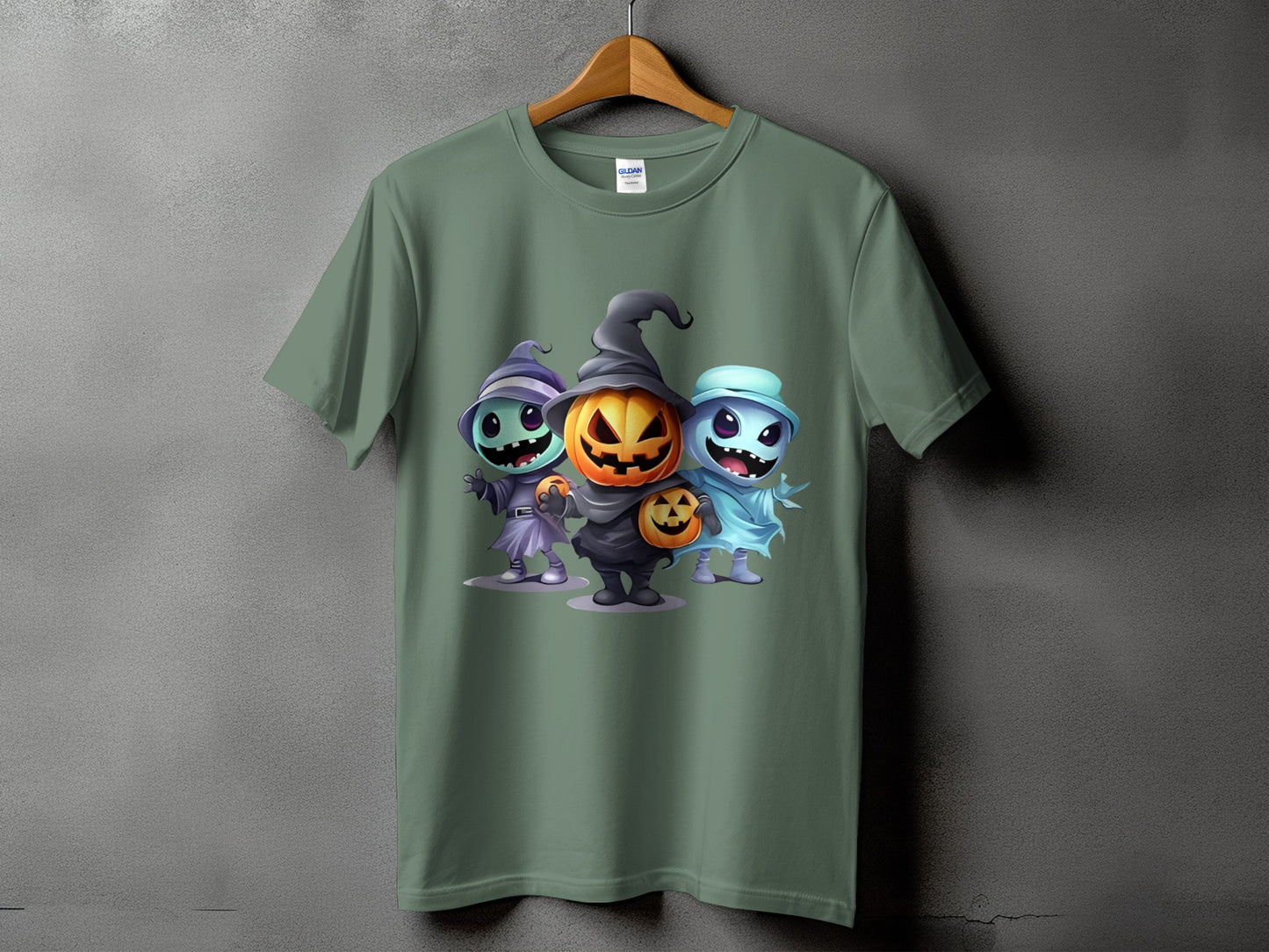 T-shirt featuring a cartoon of a pumpkin and two ghosts in Halloween costumes.