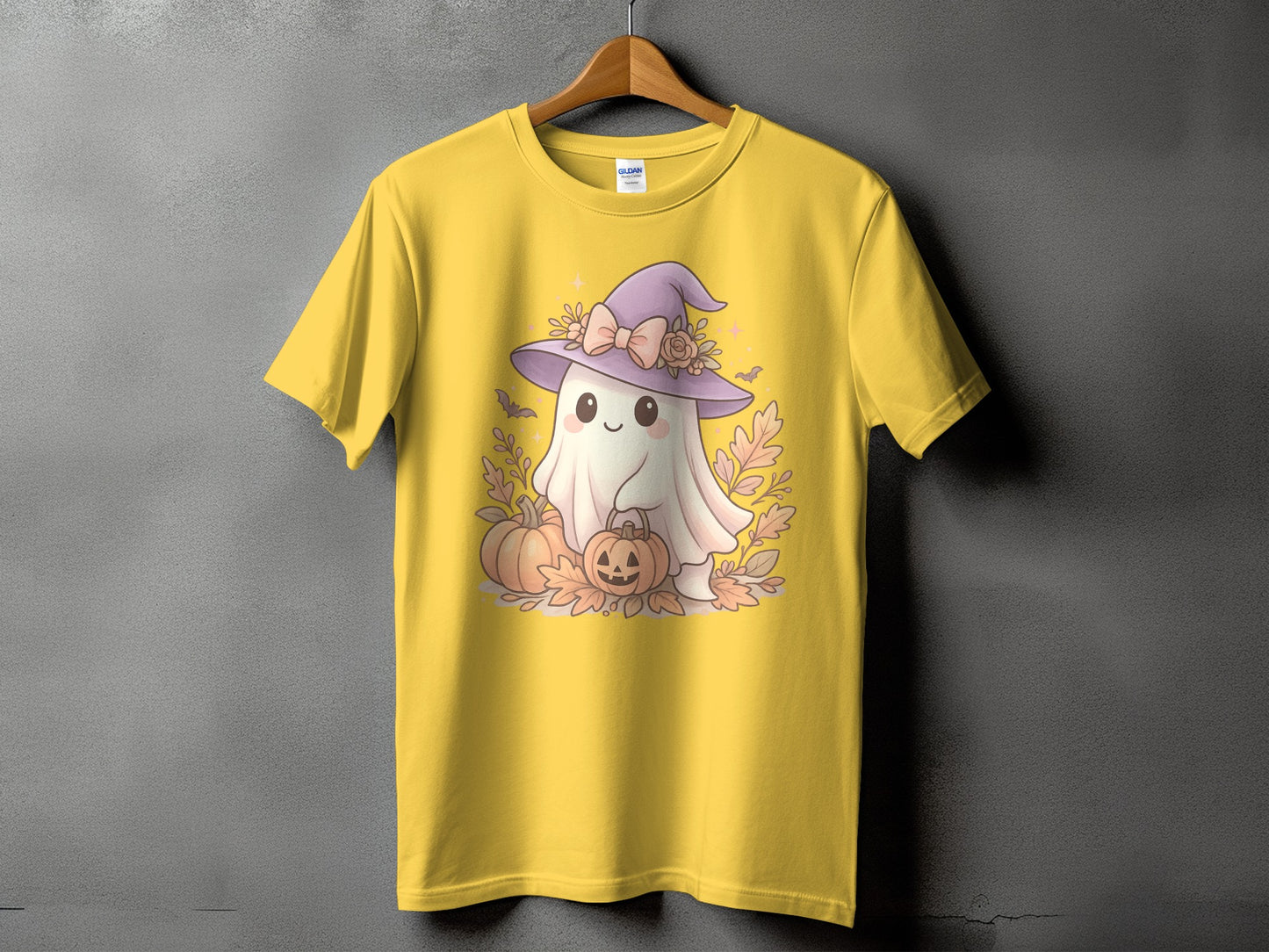Yellow t-shirt with cute ghost in witch hat and pumpkins graphic