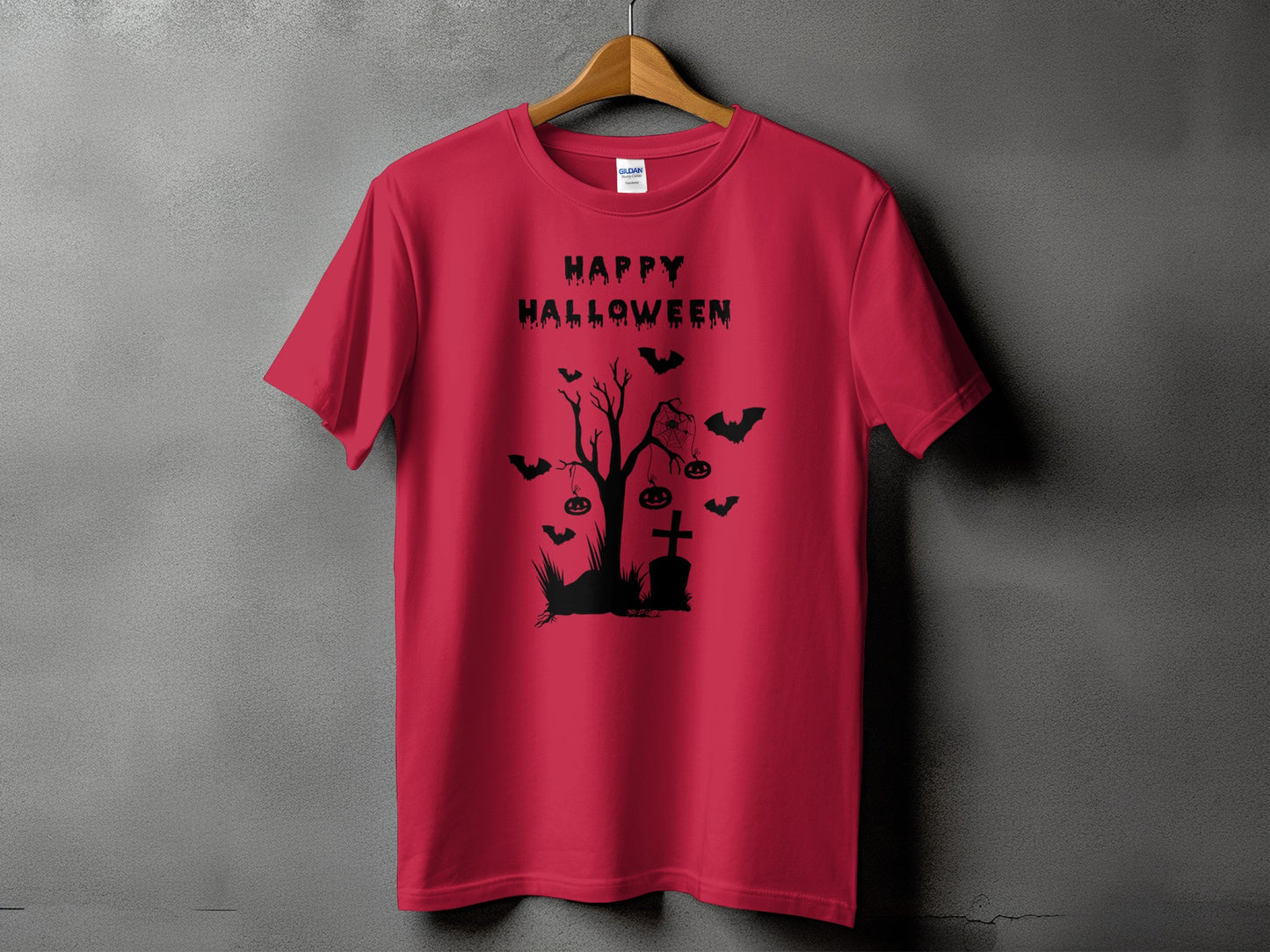 Red t-shirt with black Halloween graphic: bats, tree, tombstone, and pumpkins.