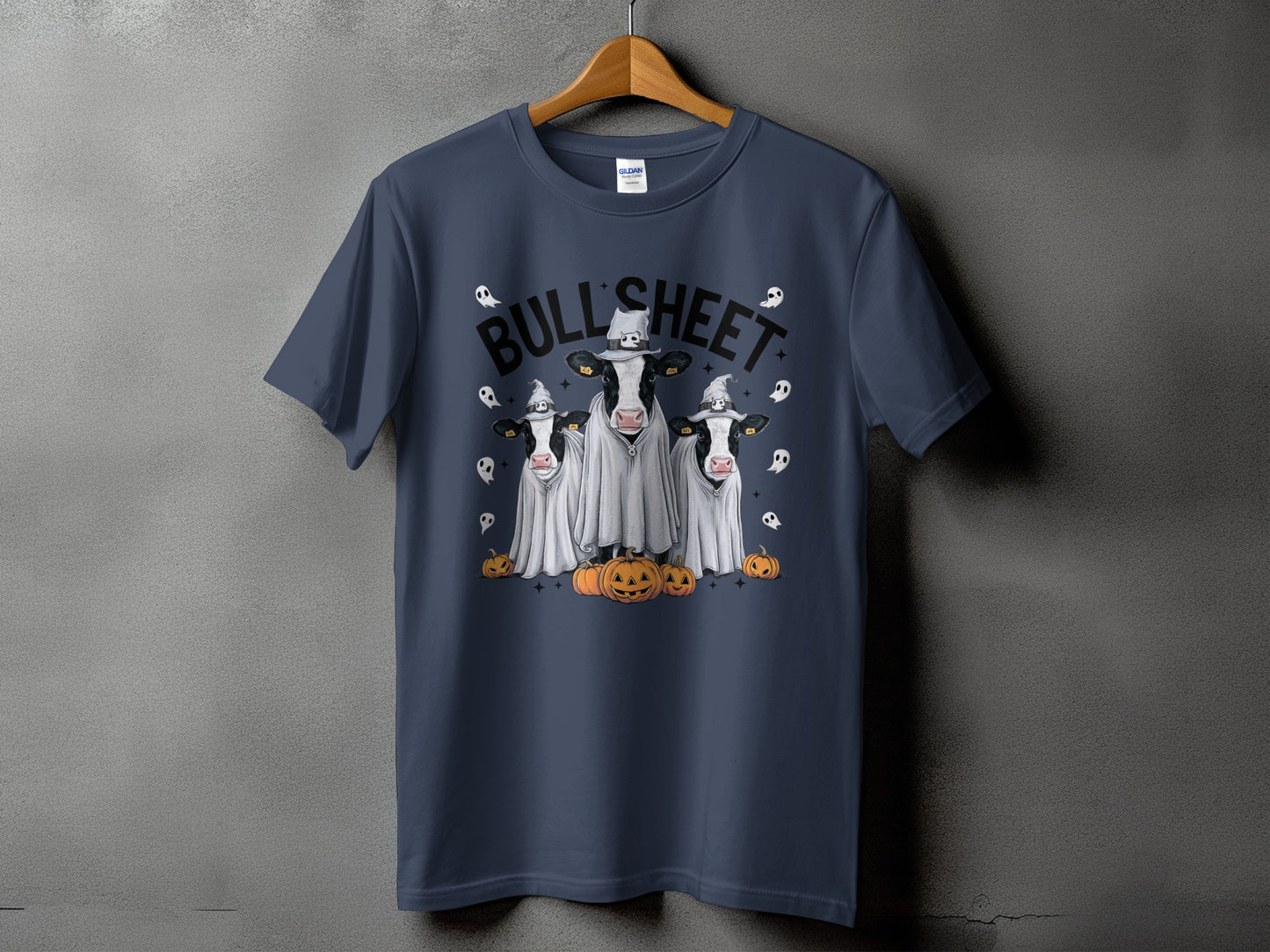 Three cows in ghost costumes with pumpkins and the text "BULL SHEET".