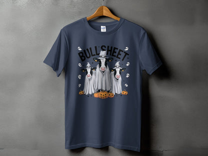 Three cows in ghost costumes with pumpkins and the text "BULL SHEET".