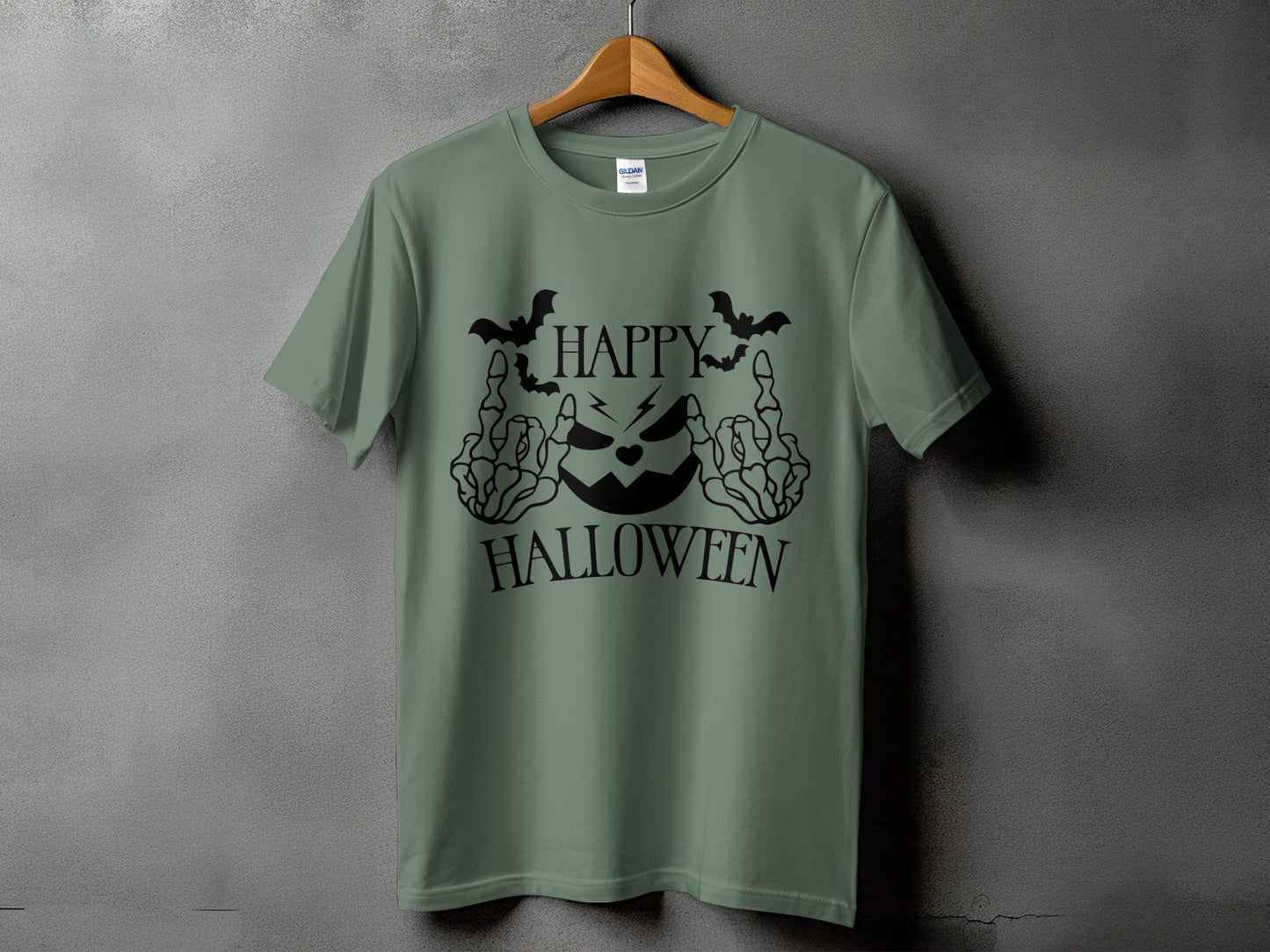 Green t-shirt with black Halloween jack-o'-lantern and skeleton hand graphics.