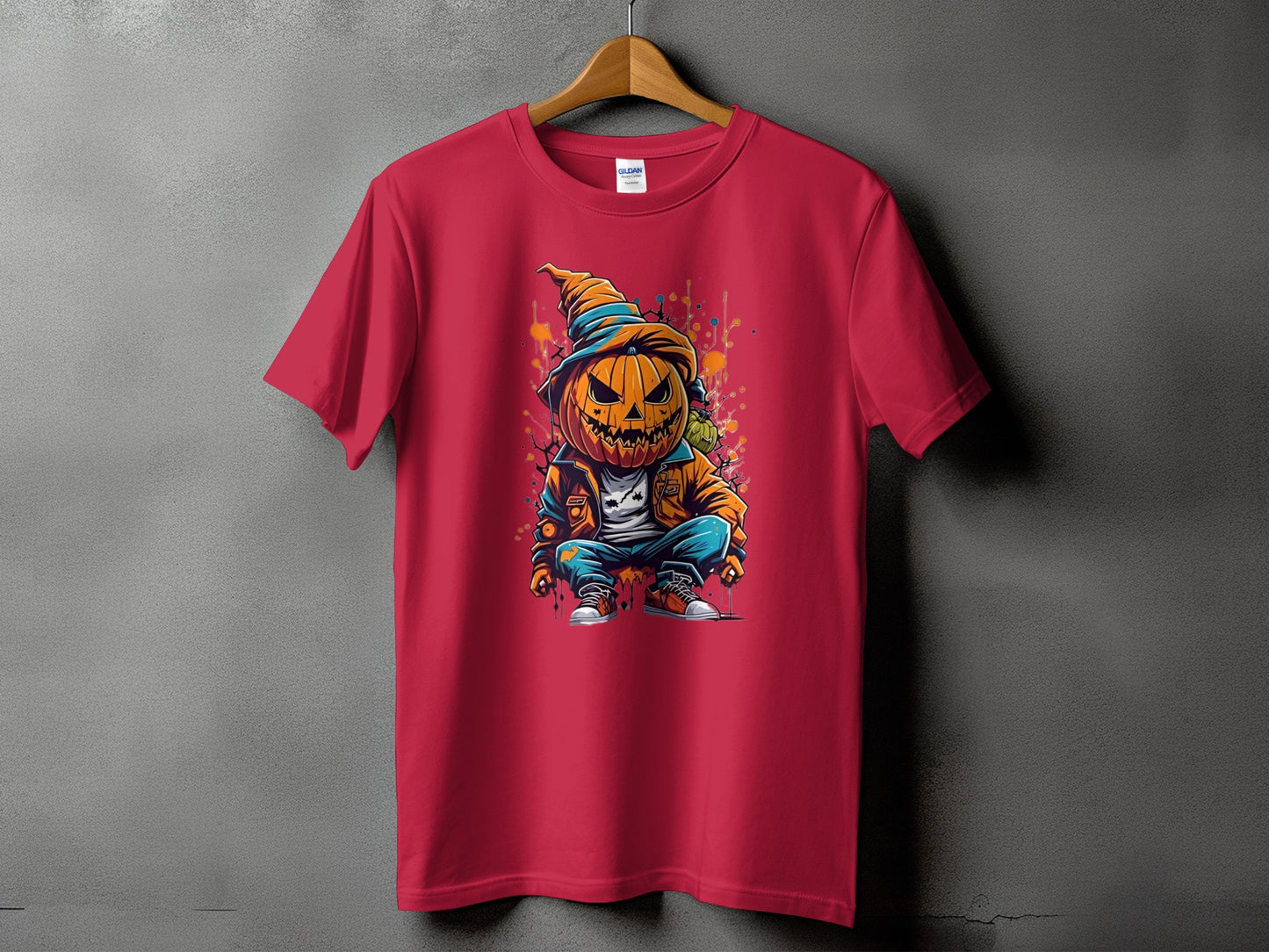 Red t-shirt with a cartoon pumpkin character wearing a hat and jacket.