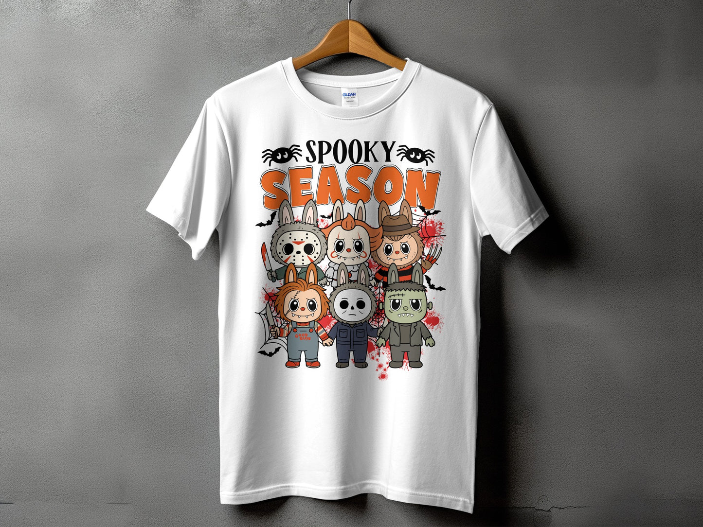 White t-shirt with "Spooky Season" text and cartoon horror characters.