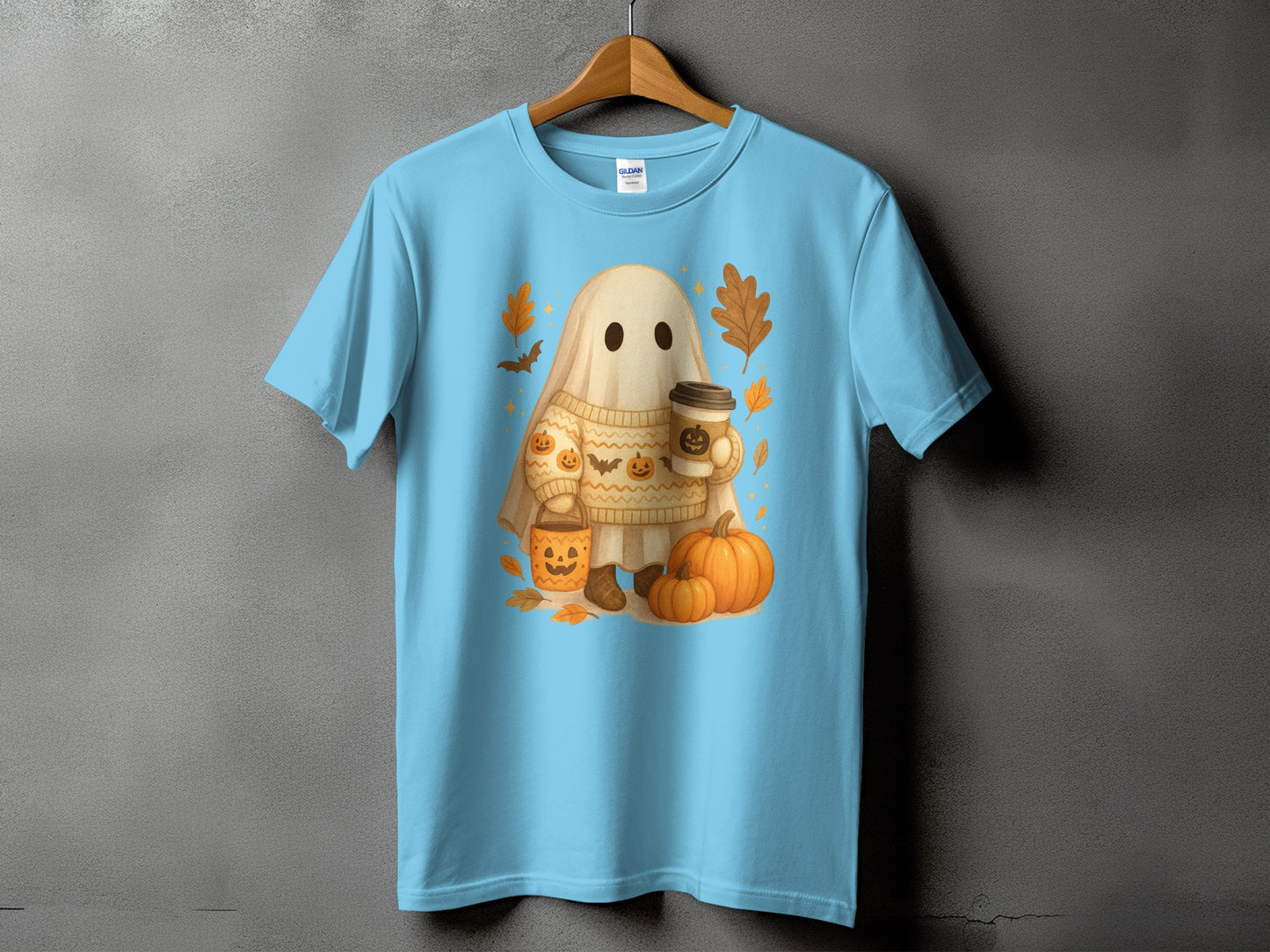 Light blue t-shirt with a cute ghost holding coffee and surrounded by pumpkins.