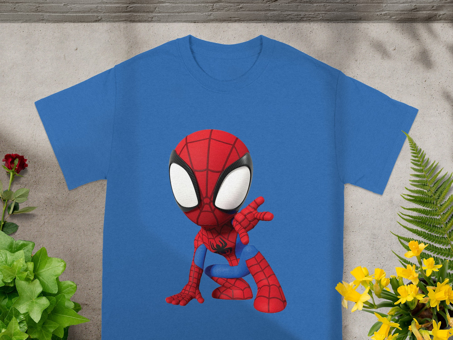 Blue t-shirt with a chibi Spider-Man graphic in a crouching pose.