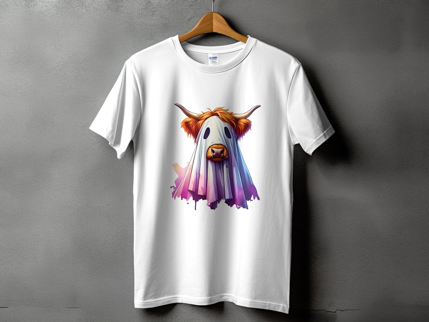 White t-shirt with a Highland cow dressed as a ghost graphic.