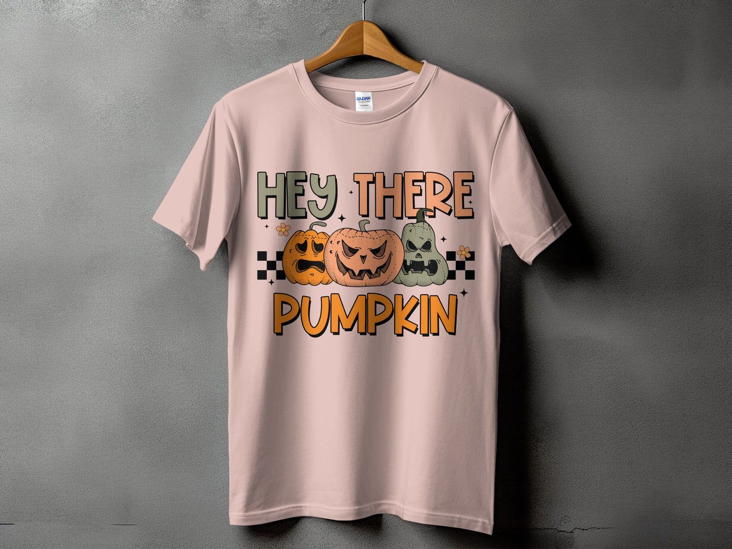 Pink t-shirt with Halloween pumpkins and text "Hey There Pumpkin".