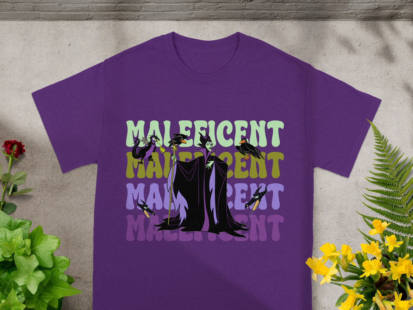Purple t-shirt with Maleficent's silhouette and name in text.