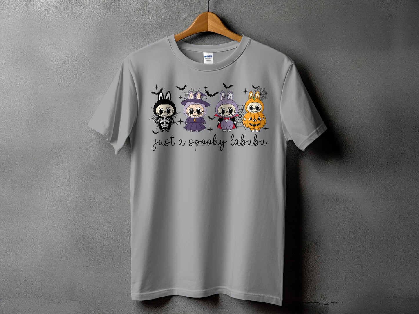 Grey t-shirt with four Halloween-themed cartoon characters and "just a spooky labubu" text.