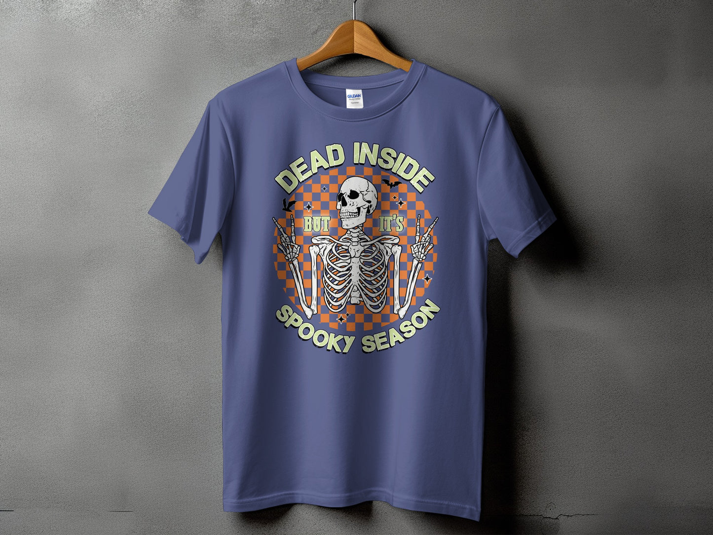 Purple t-shirt with skeleton graphic and text "Dead Inside But It's Spooky Season".