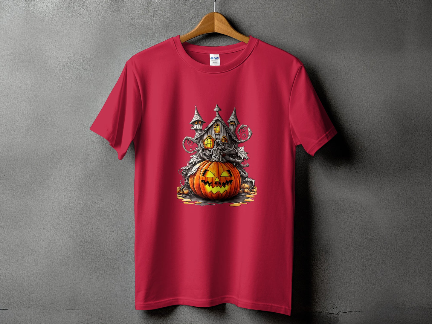 Red t-shirt featuring a spooky haunted house and jack-o'-lantern Halloween graphic.