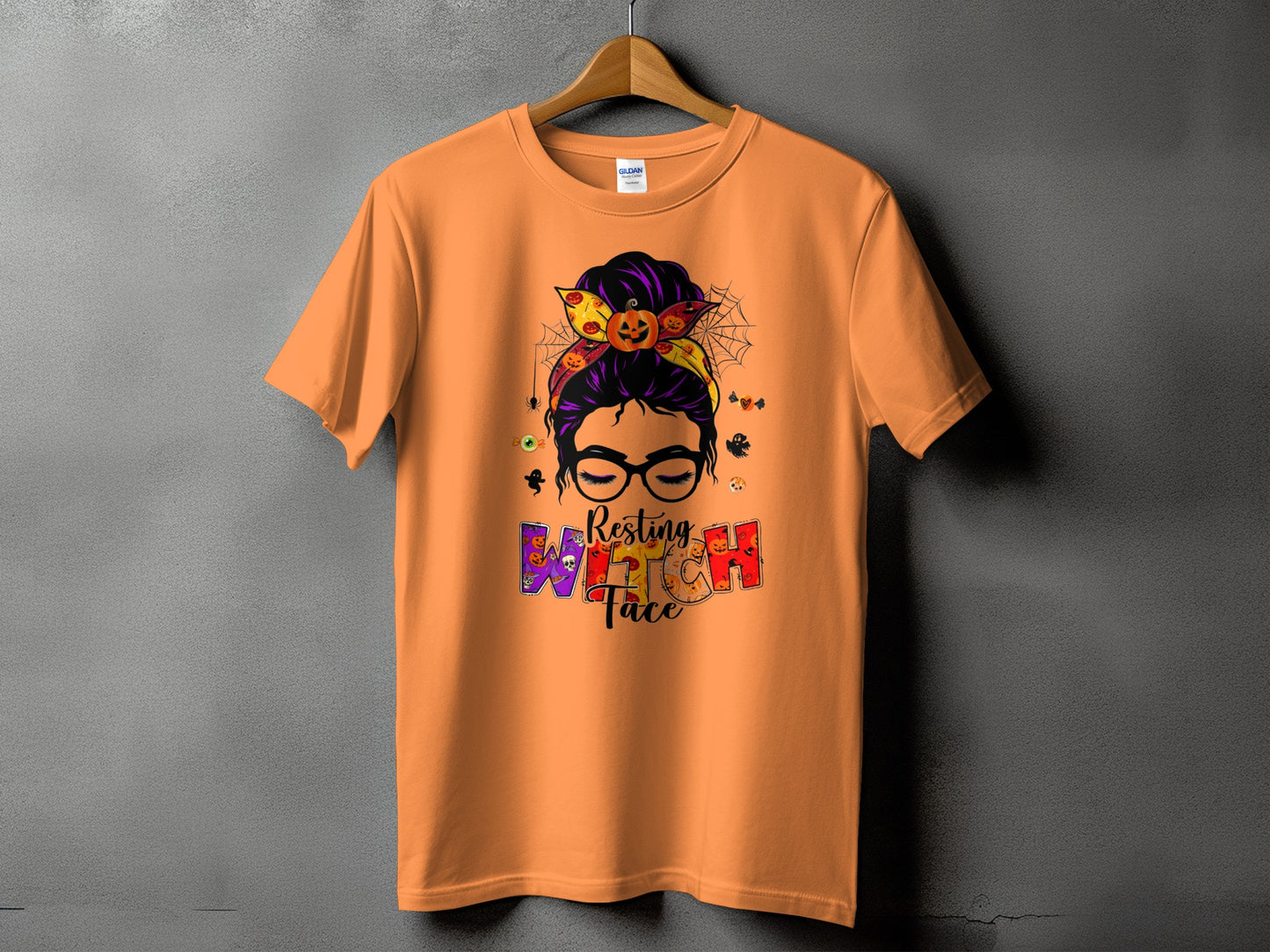 Orange t-shirt with Halloween graphic: "Resting Witch Face" and spooky icons.