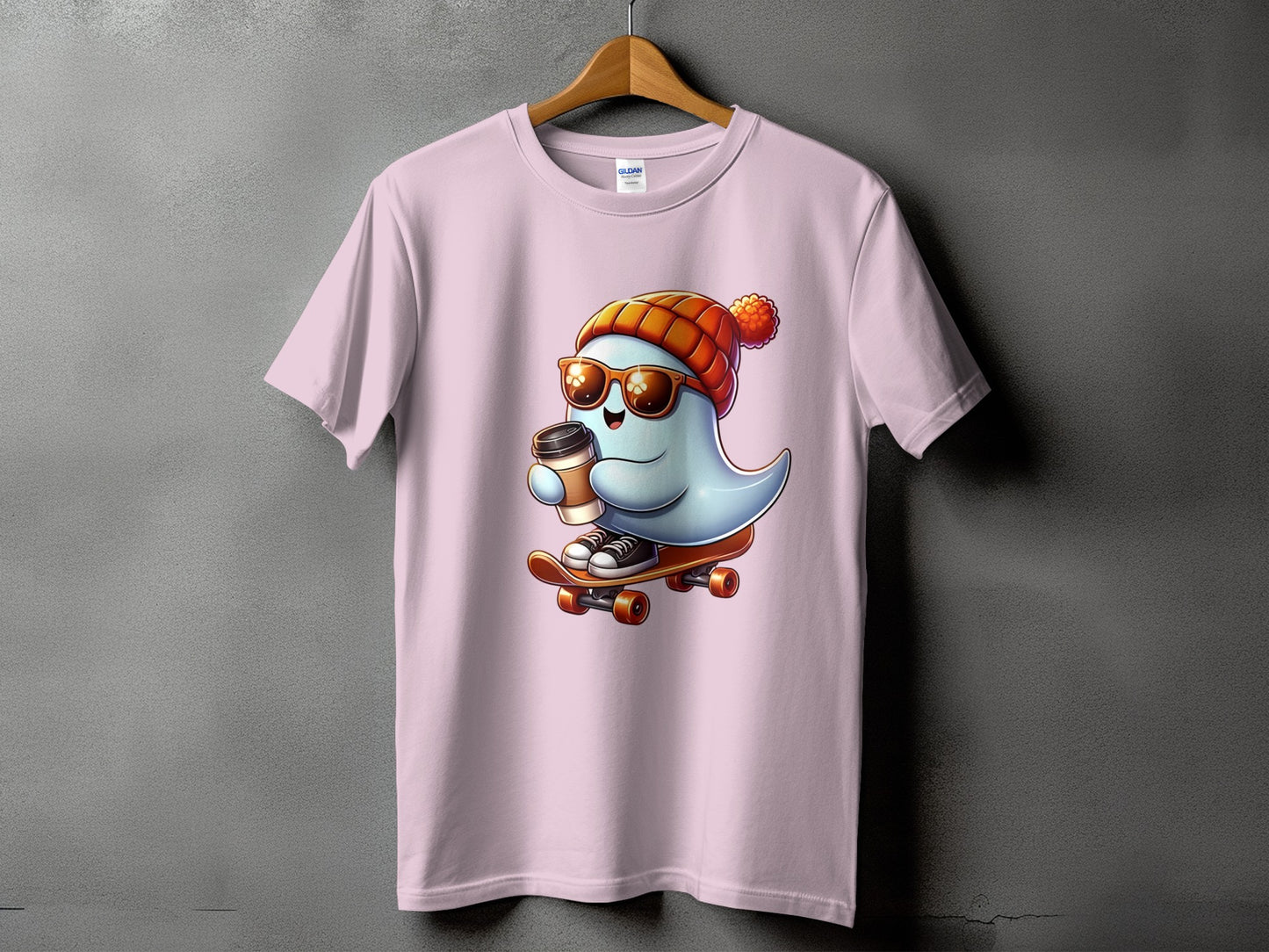 Light pink t-shirt with a cartoon ghost wearing a beanie, sunglasses, and holding coffee on a skateboard.