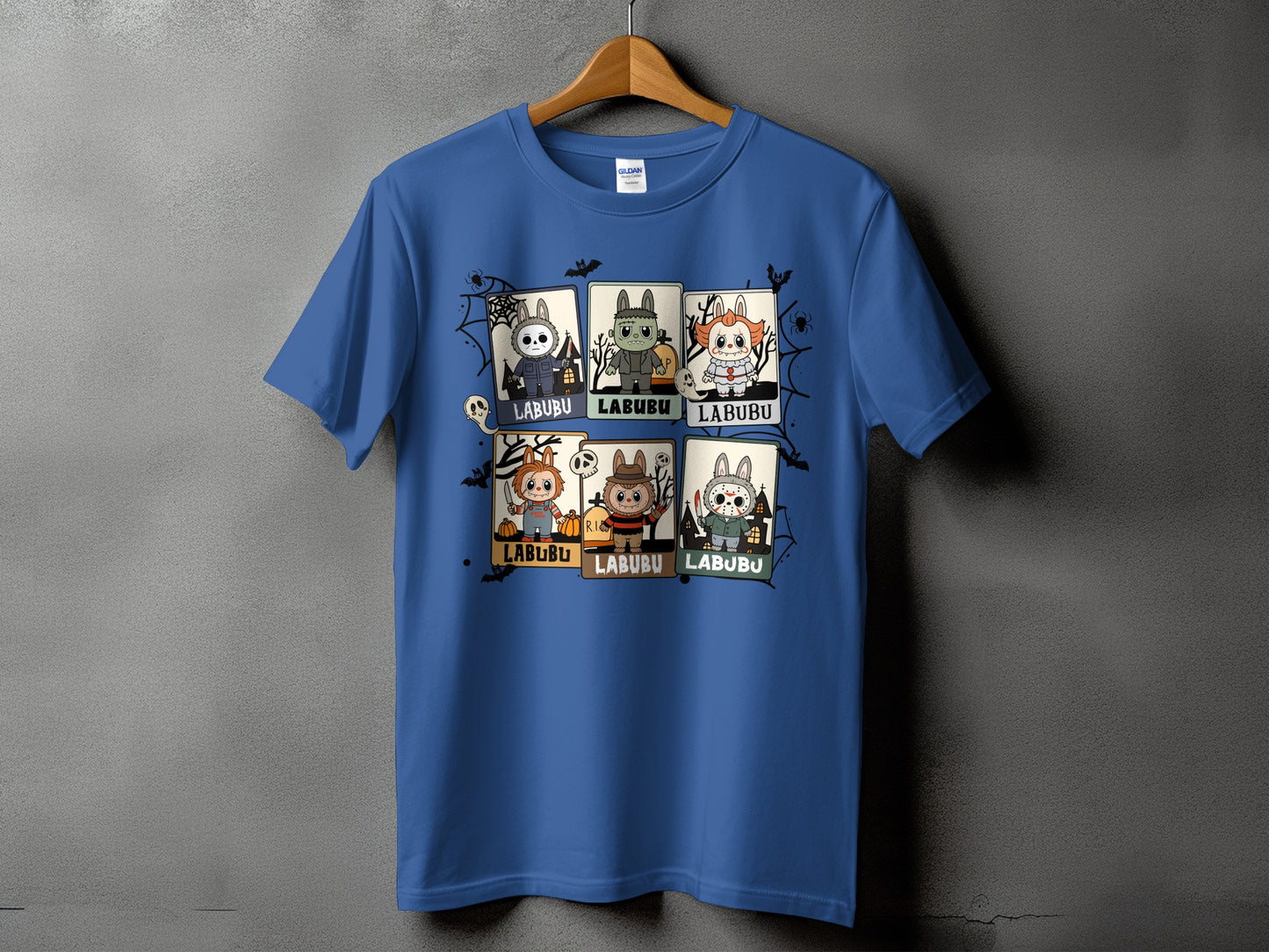 Blue t-shirt with six Halloween-themed cartoon characters, each in a framed box with "LABUBU" text.