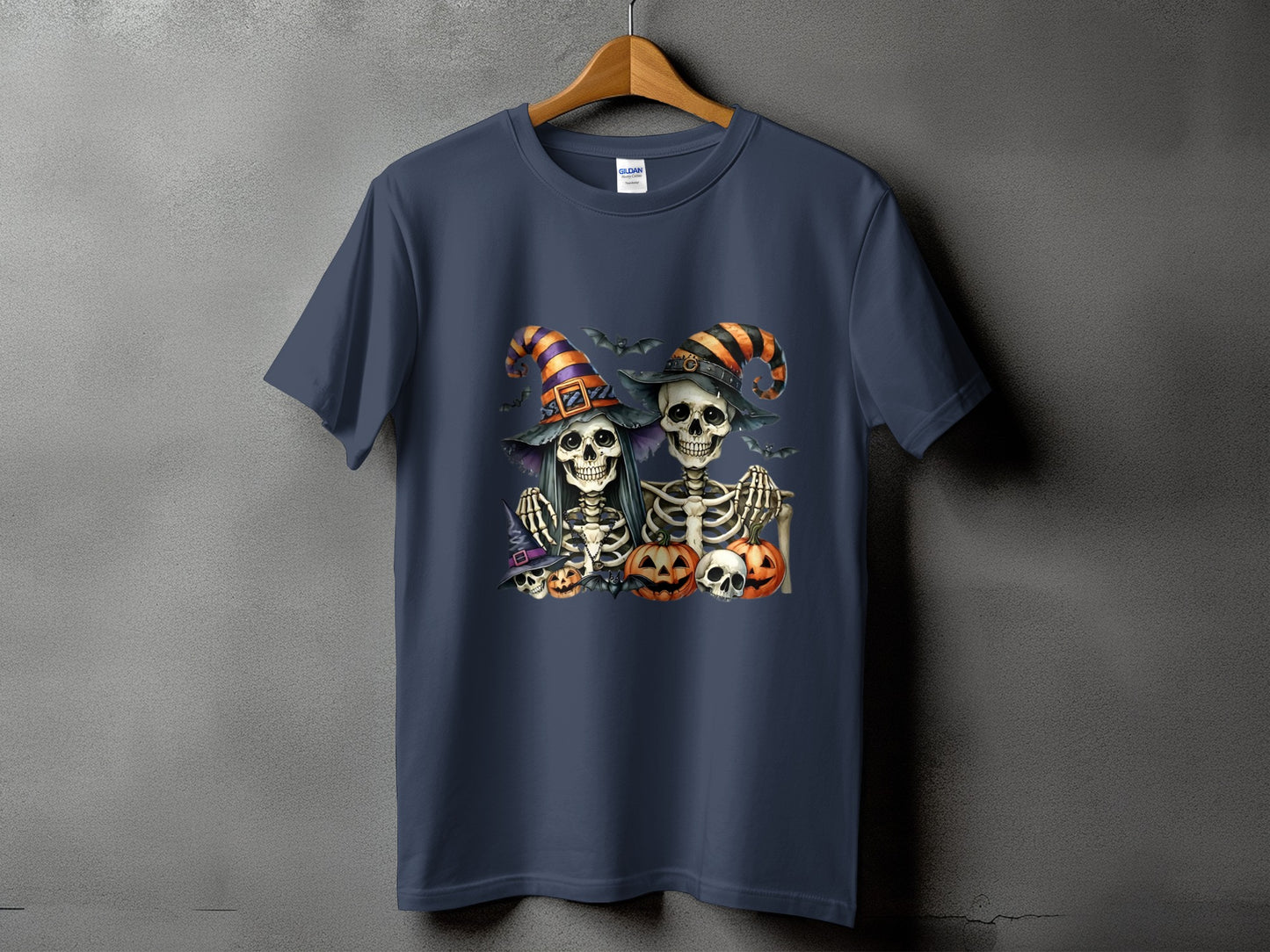 T-shirt featuring Halloween skeletons, pumpkins, bats, and witch hats.