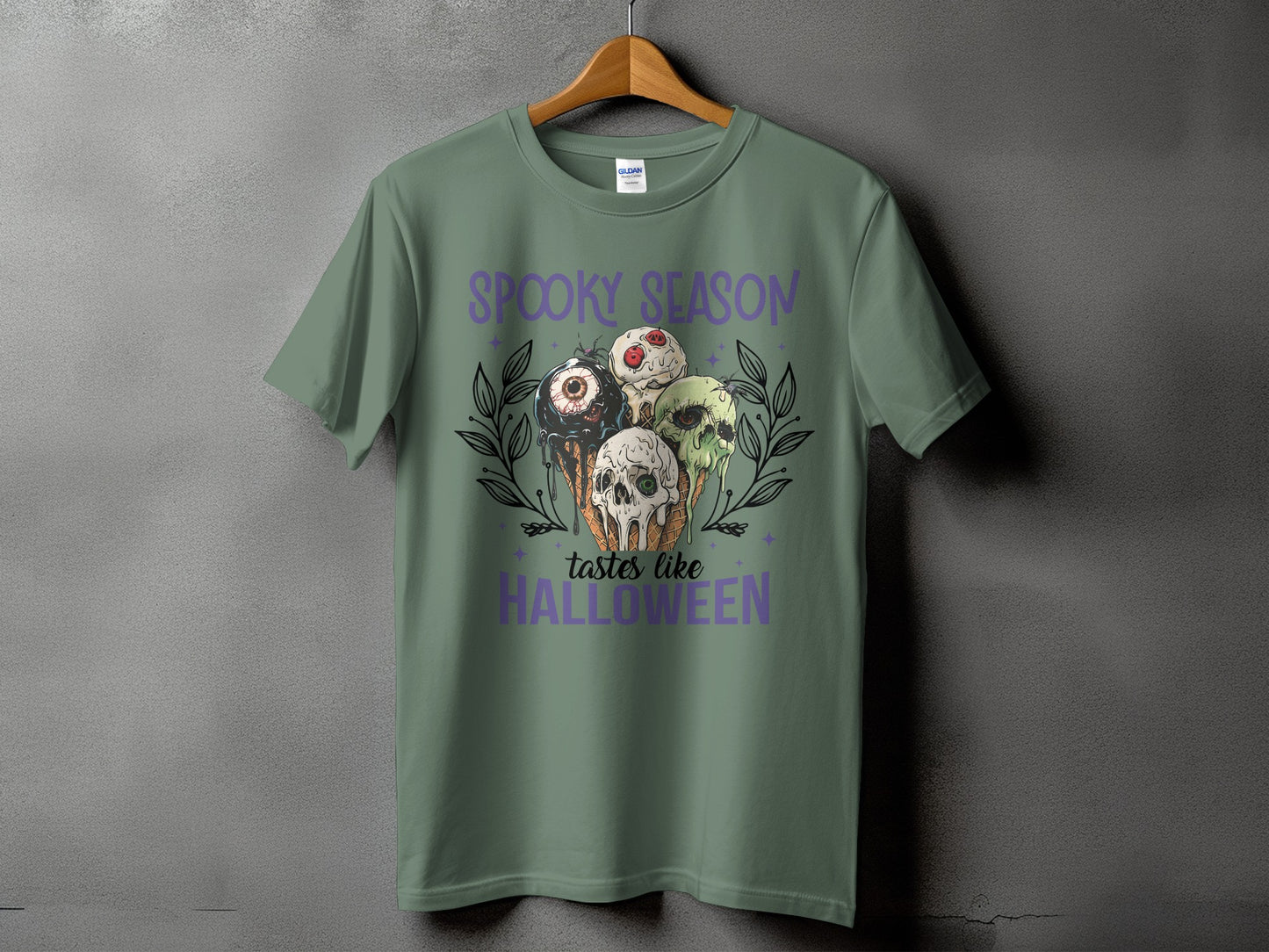 Green t-shirt with "Spooky Season Tastes Like Halloween" and Halloween ice cream graphic.