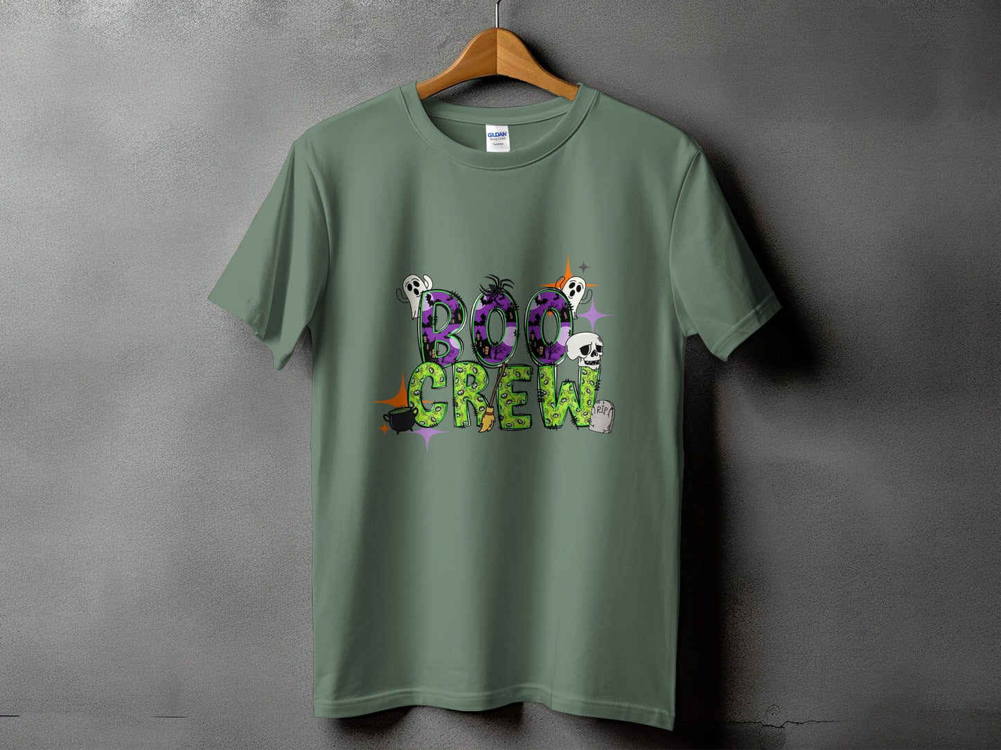 Green t-shirt with "Boo Crew" Halloween graphic featuring ghosts, skulls, and bats.