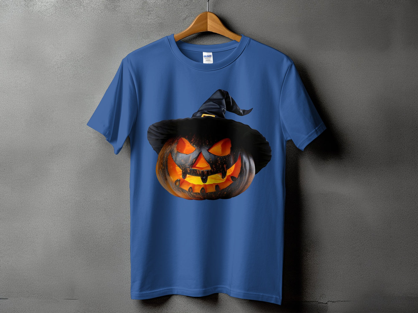 Blue t-shirt with a carved, glowing jack-o'-lantern wearing a witch hat.