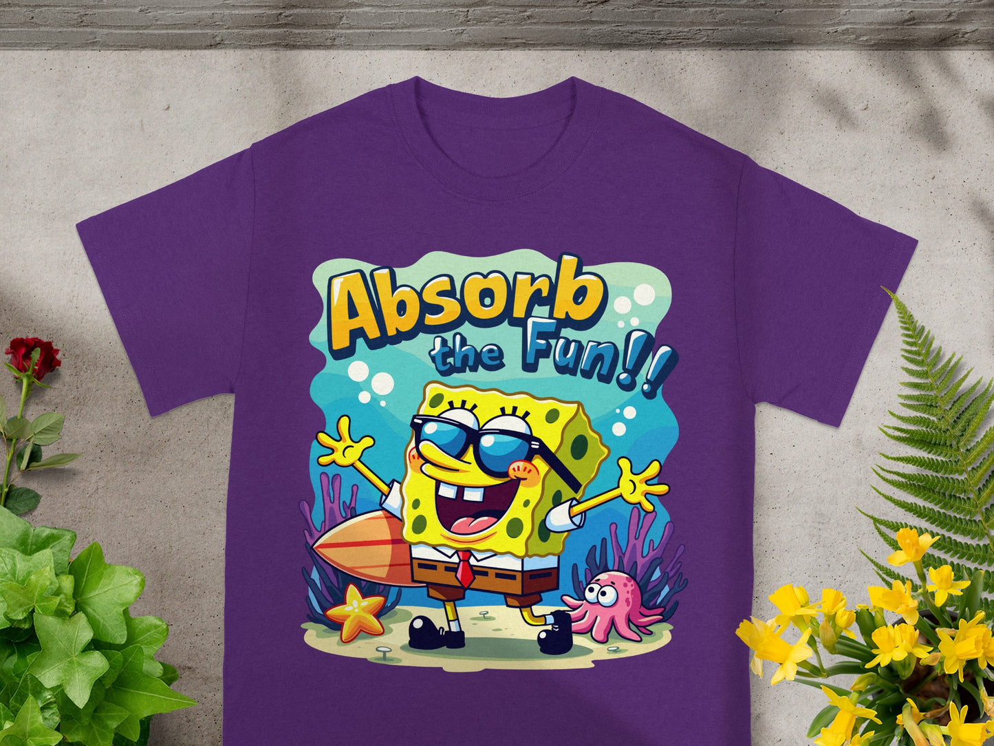 Purple t-shirt with Spongebob Squarepants graphic reading "Absorb the Fun!".