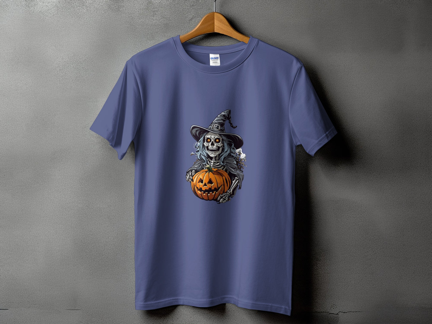 T-shirt with a skeleton wearing a witch hat and holding a jack-o'-lantern.