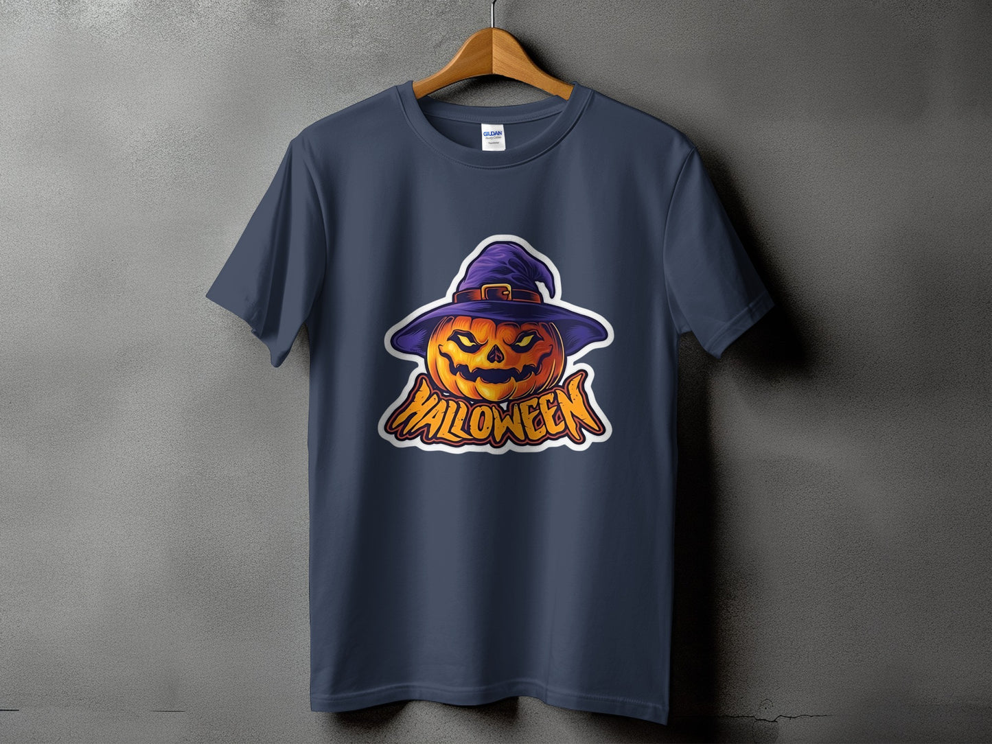 Dark blue t-shirt with a spooky Halloween pumpkin wearing a witch hat and text.