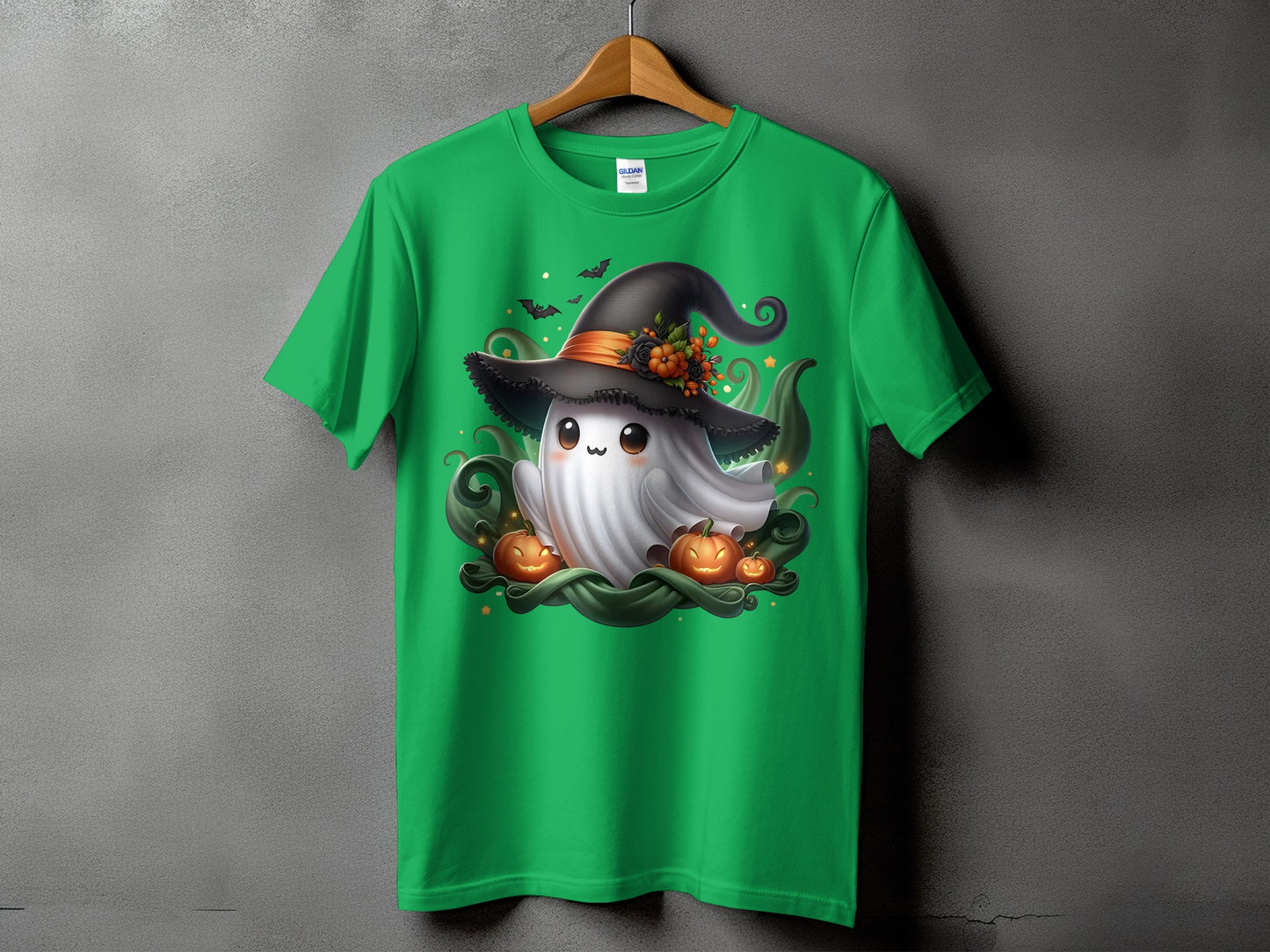 Green t-shirt with Halloween ghost, pumpkins, and bats graphic design.