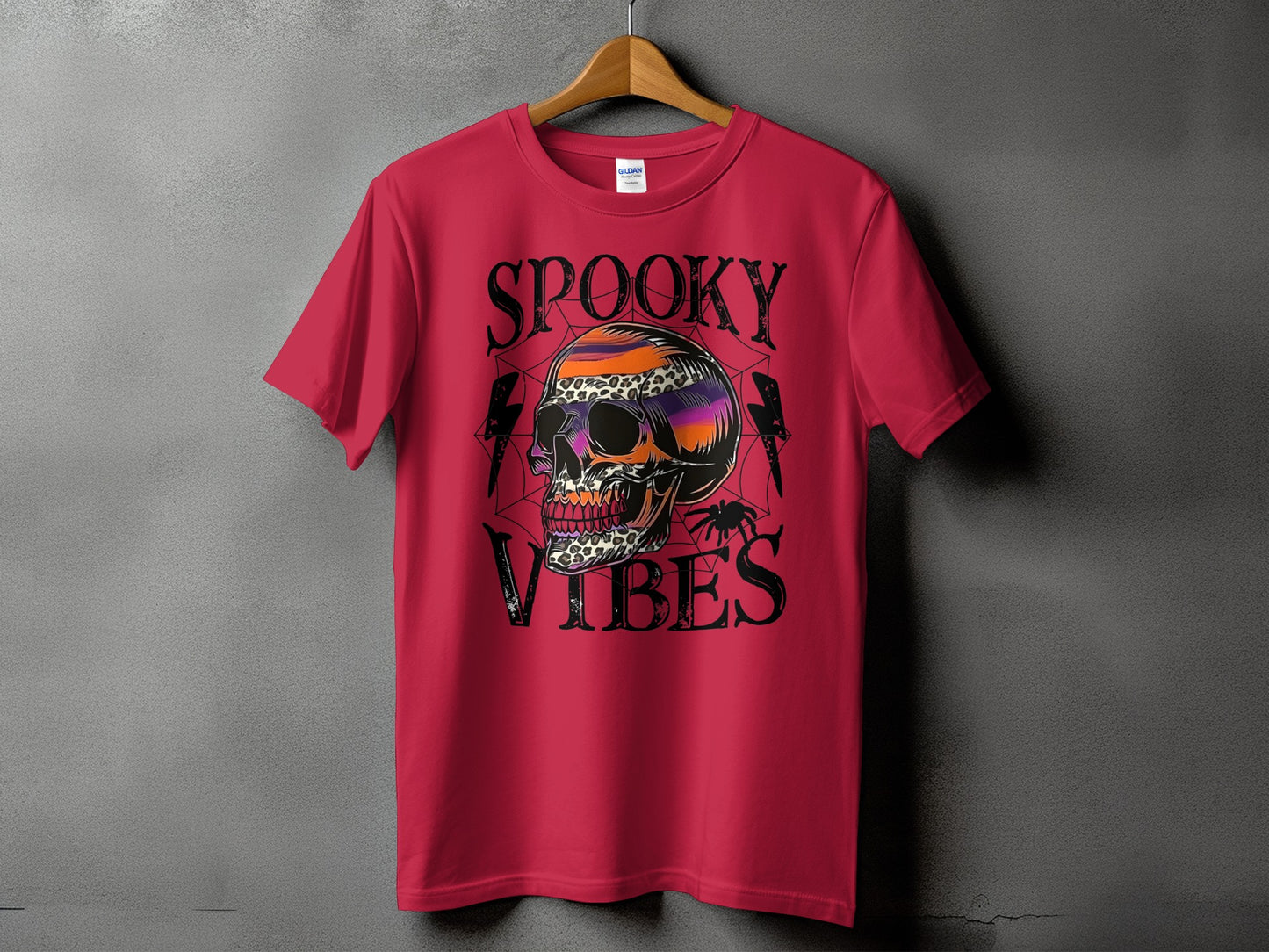 Red t-shirt with "Spooky Vibes" text and a skull graphic with spiderwebs.