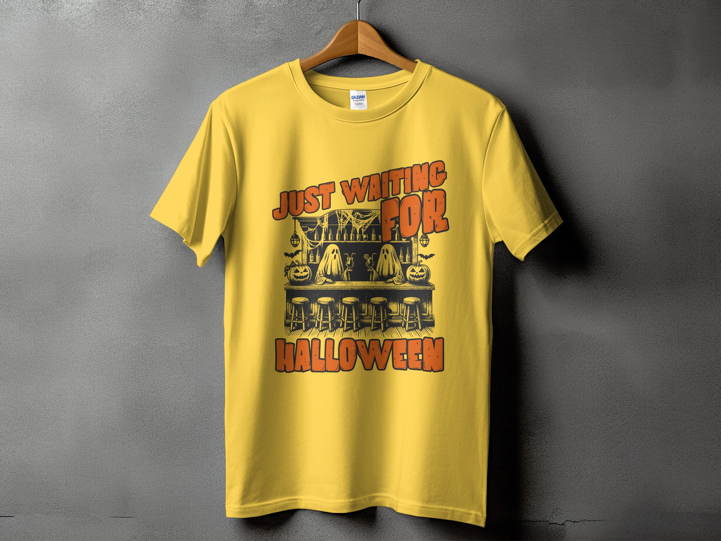 Yellow t-shirt with "Just Waiting For Halloween" text and Halloween-themed bar scene.