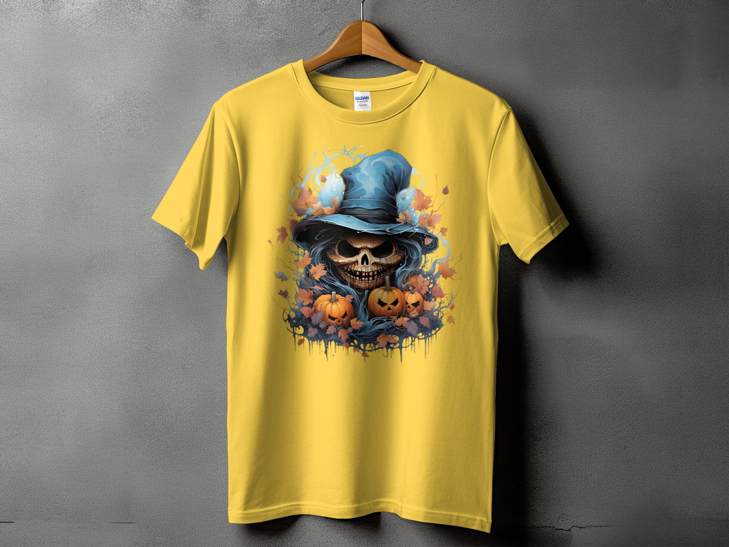 Yellow t-shirt with skull, pumpkins, and witch hat Halloween graphic.