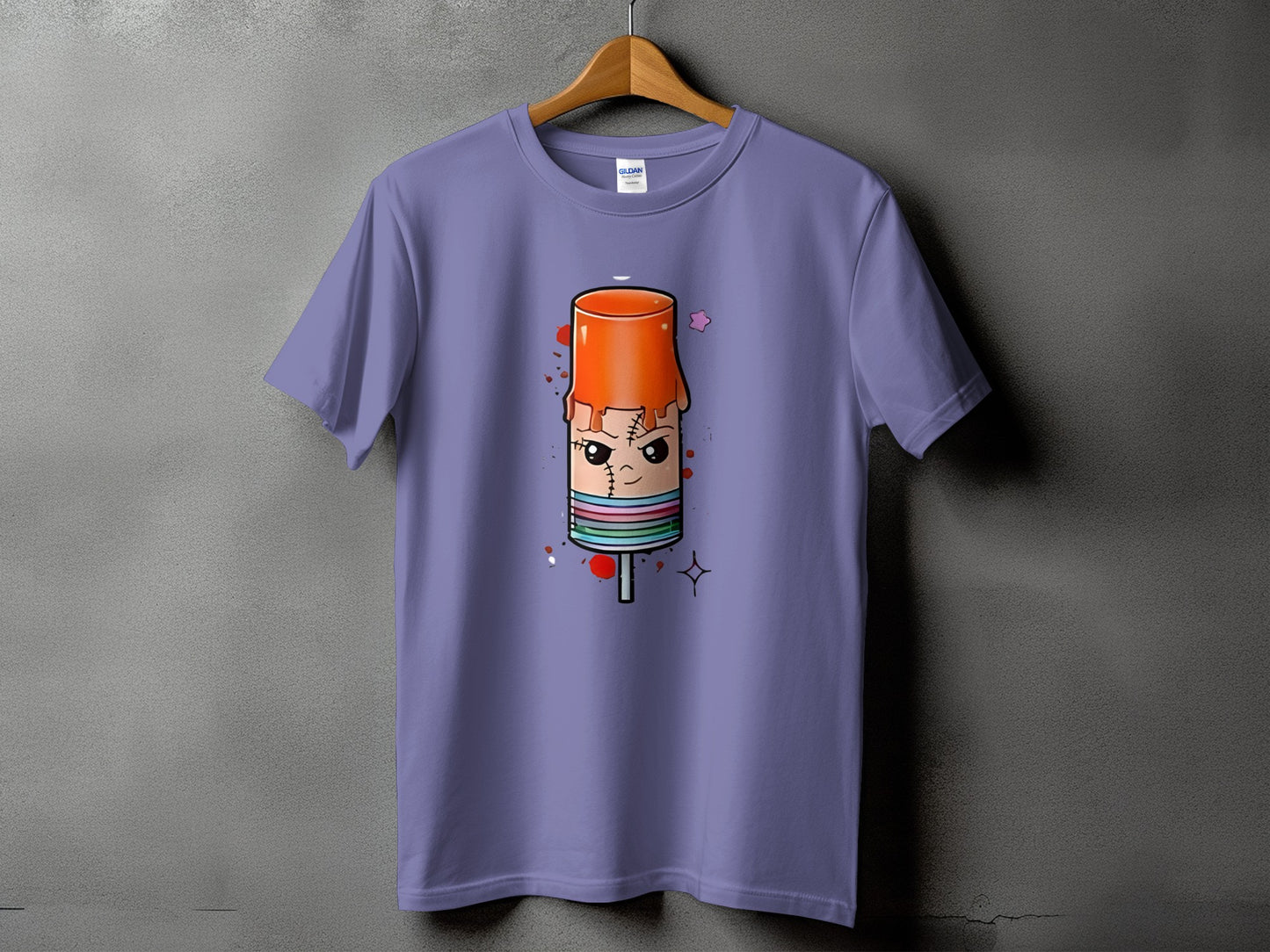 Purple t-shirt with a cartoon ice pop character graphic with stitches and colorful stripes.
