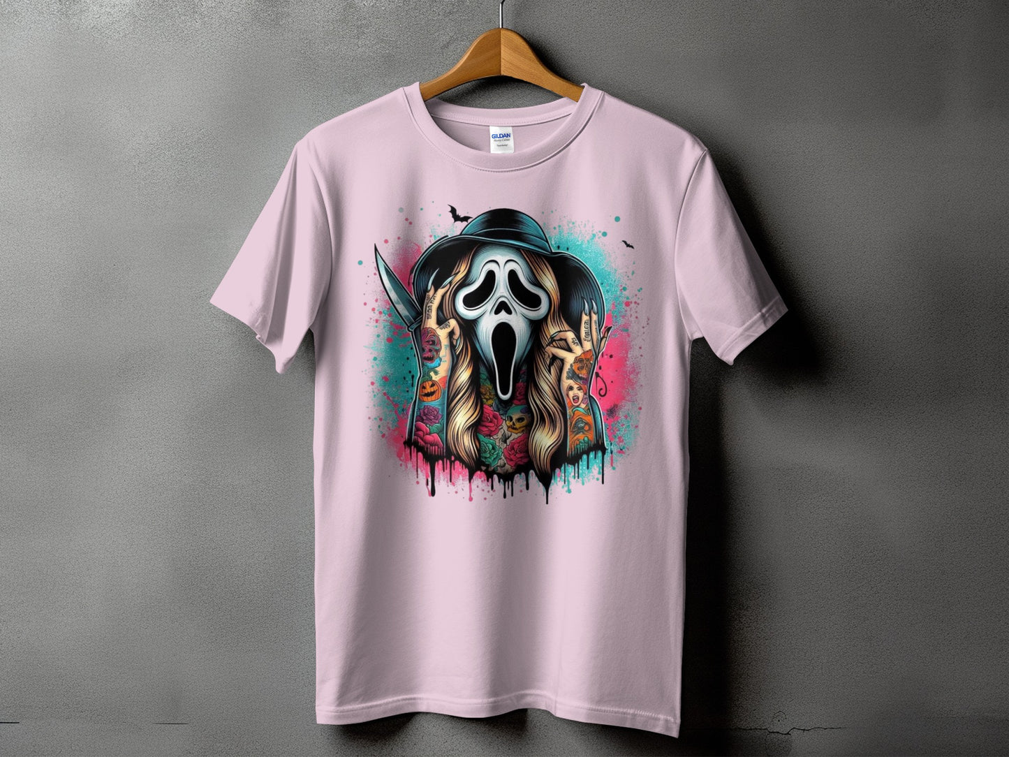 Pink t-shirt with a Ghostface mask, knife, and Halloween-themed tattoos.