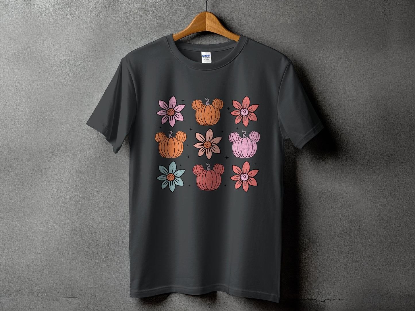 Dark grey t-shirt with a grid of colorful flowers and Mickey Mouse pumpkins.