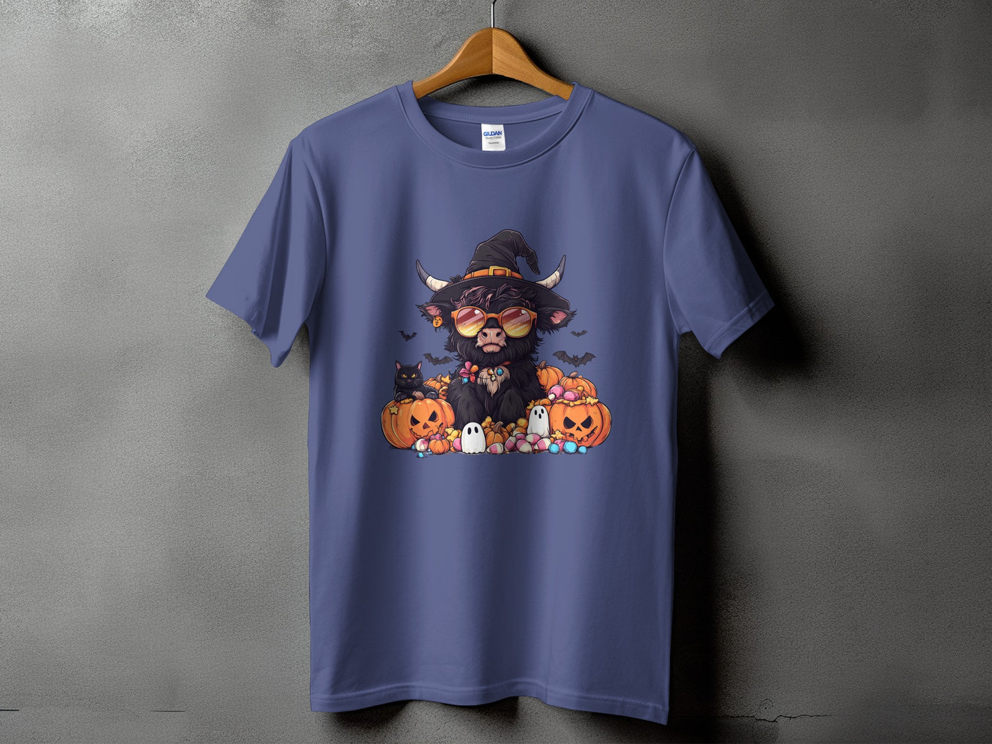 Highland cow in witch hat with sunglasses surrounded by pumpkins, cats, and ghosts.