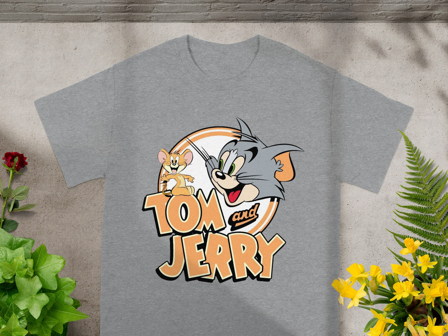 Gray t-shirt with Tom and Jerry cartoon characters and logo.