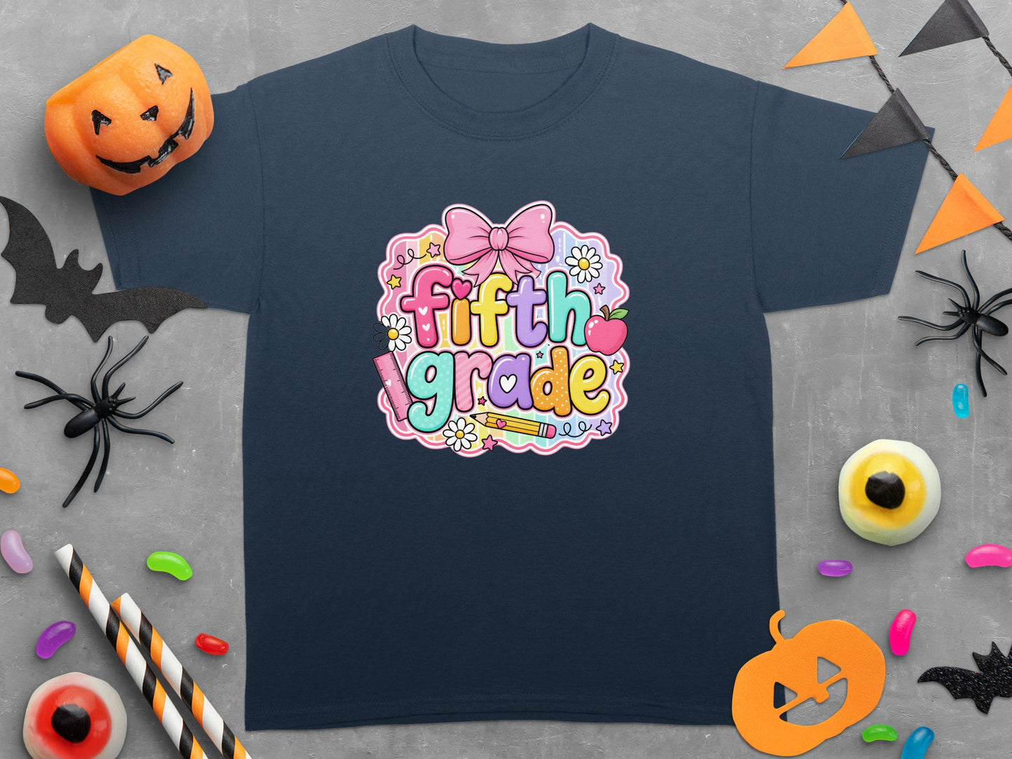 Dark blue t-shirt with "fifth grade" text and Halloween decorations.