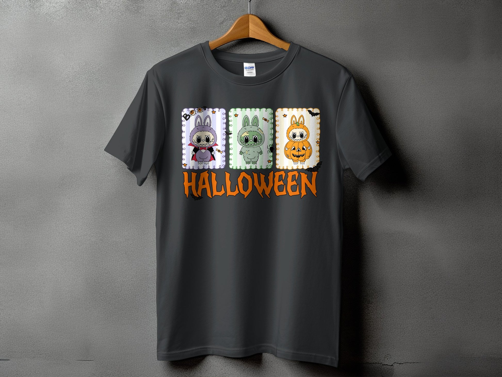 Dark grey t-shirt with three cartoon animals in Halloween costumes and the word "HALLOWEEN".