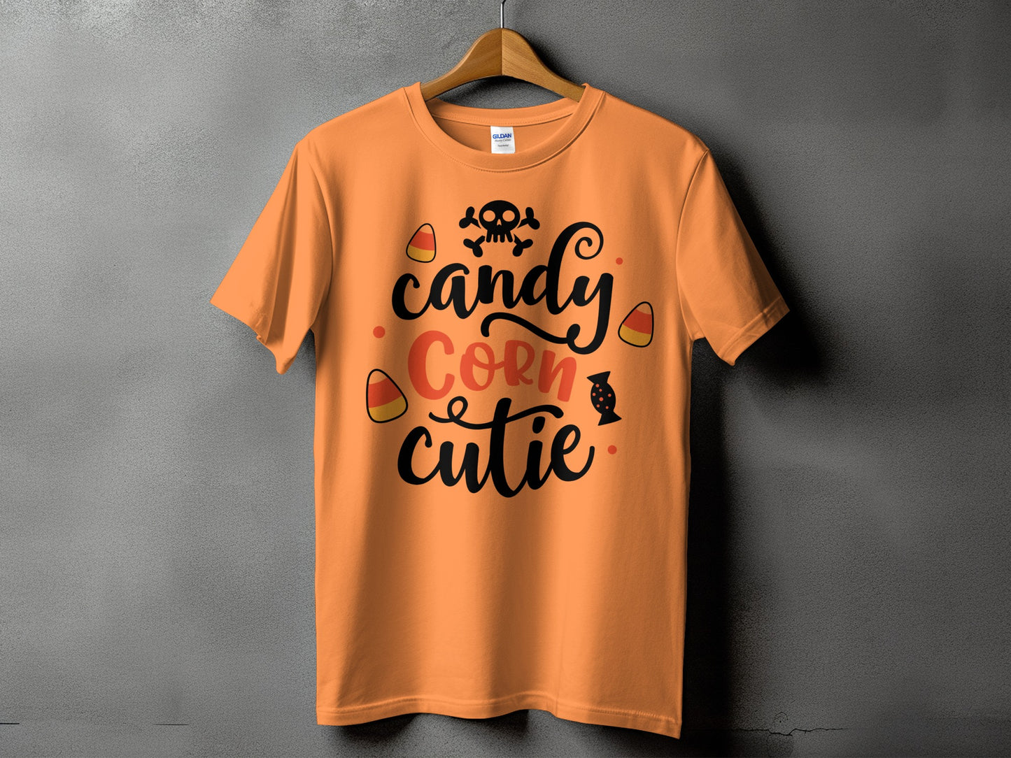 Orange t-shirt with "candy Corn cutie" and Halloween graphics.