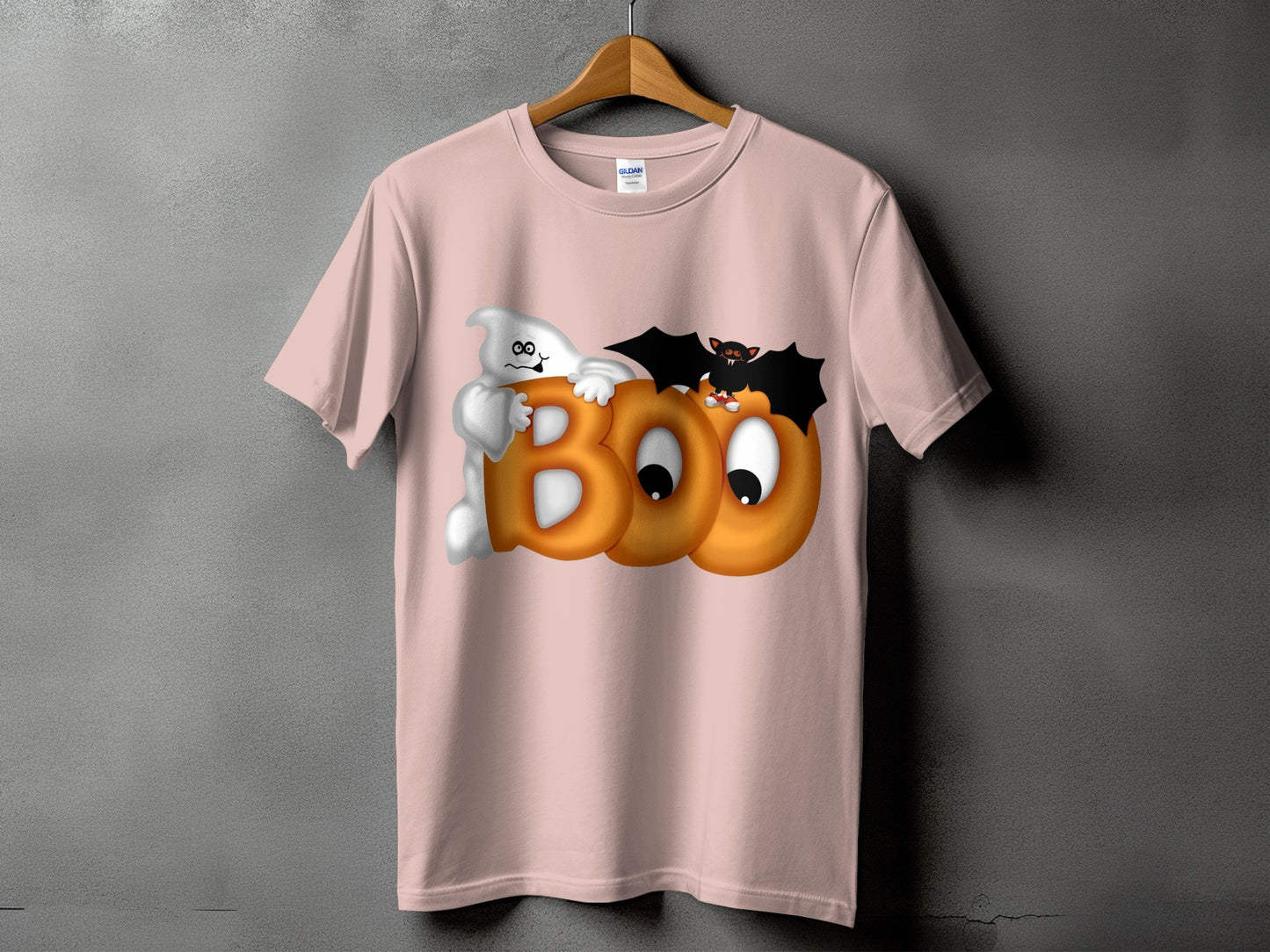 Pink t-shirt with ghost, bat, and "BOO" text graphic.