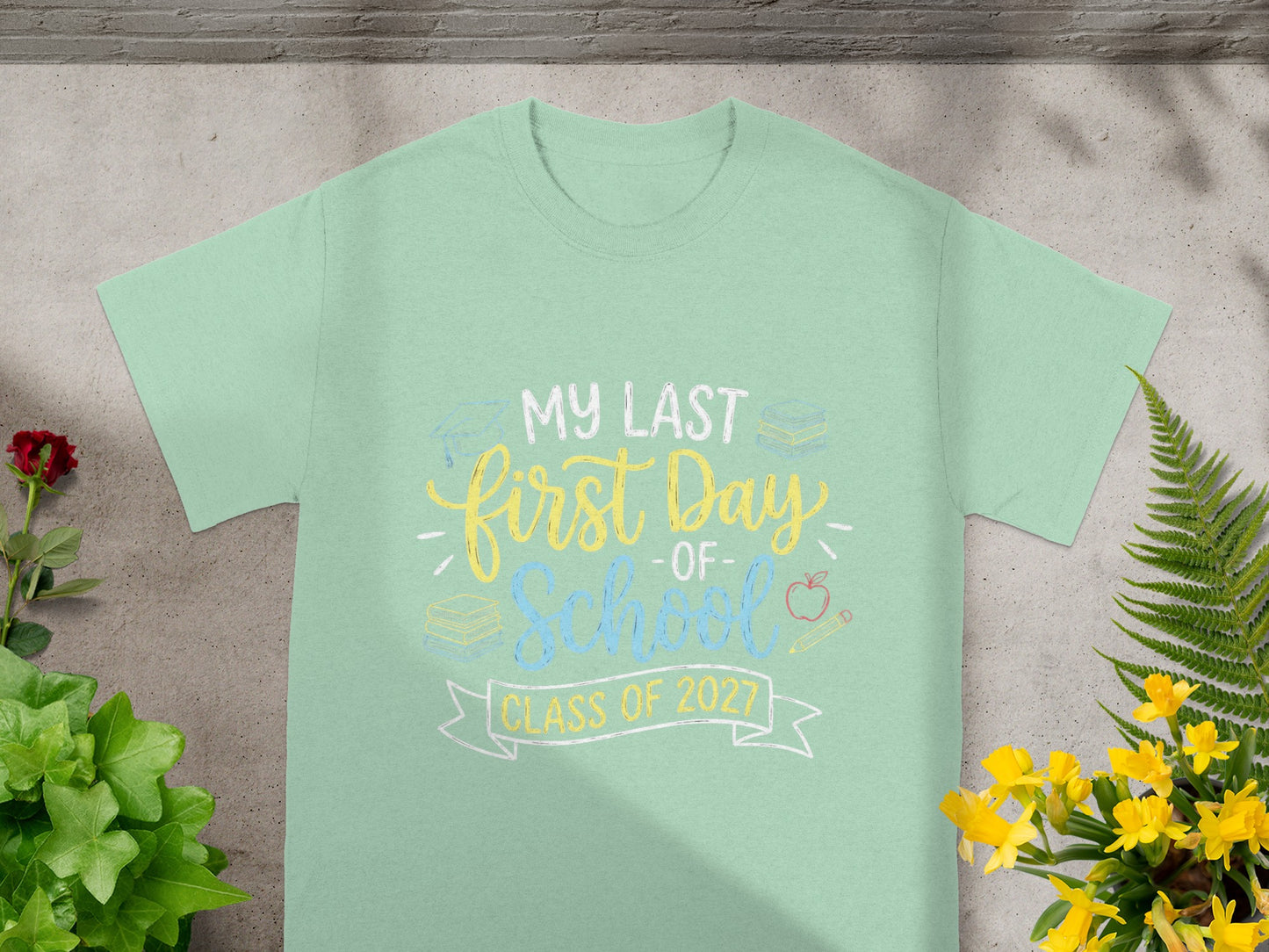 Light green t-shirt with "My Last First Day of School Class of 2027" graphic.