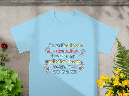 Light blue t-shirt with "So excited I got a raise today!" text.