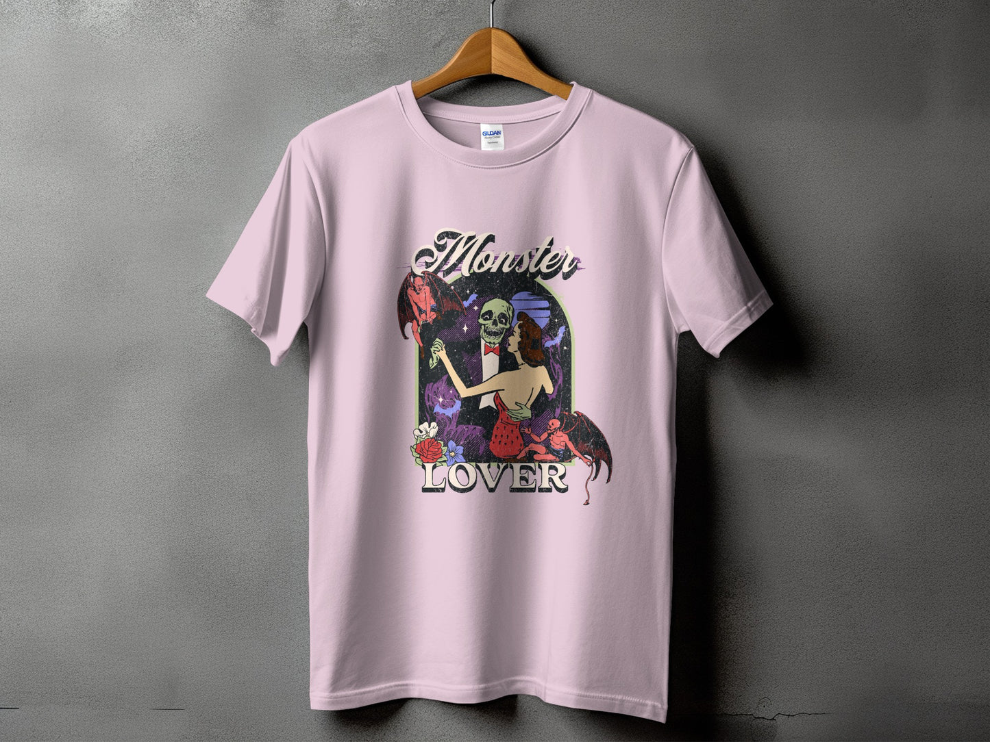 Pink t-shirt with "Monster Lover" text and a skull couple graphic.