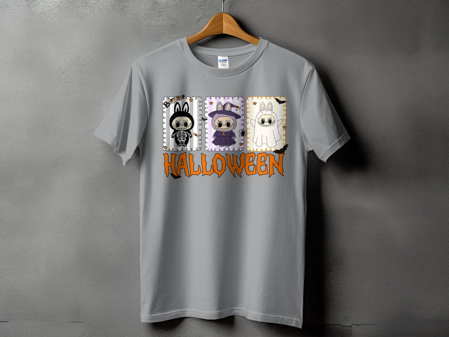 Gray t-shirt with Halloween graphic featuring three cute characters and text.