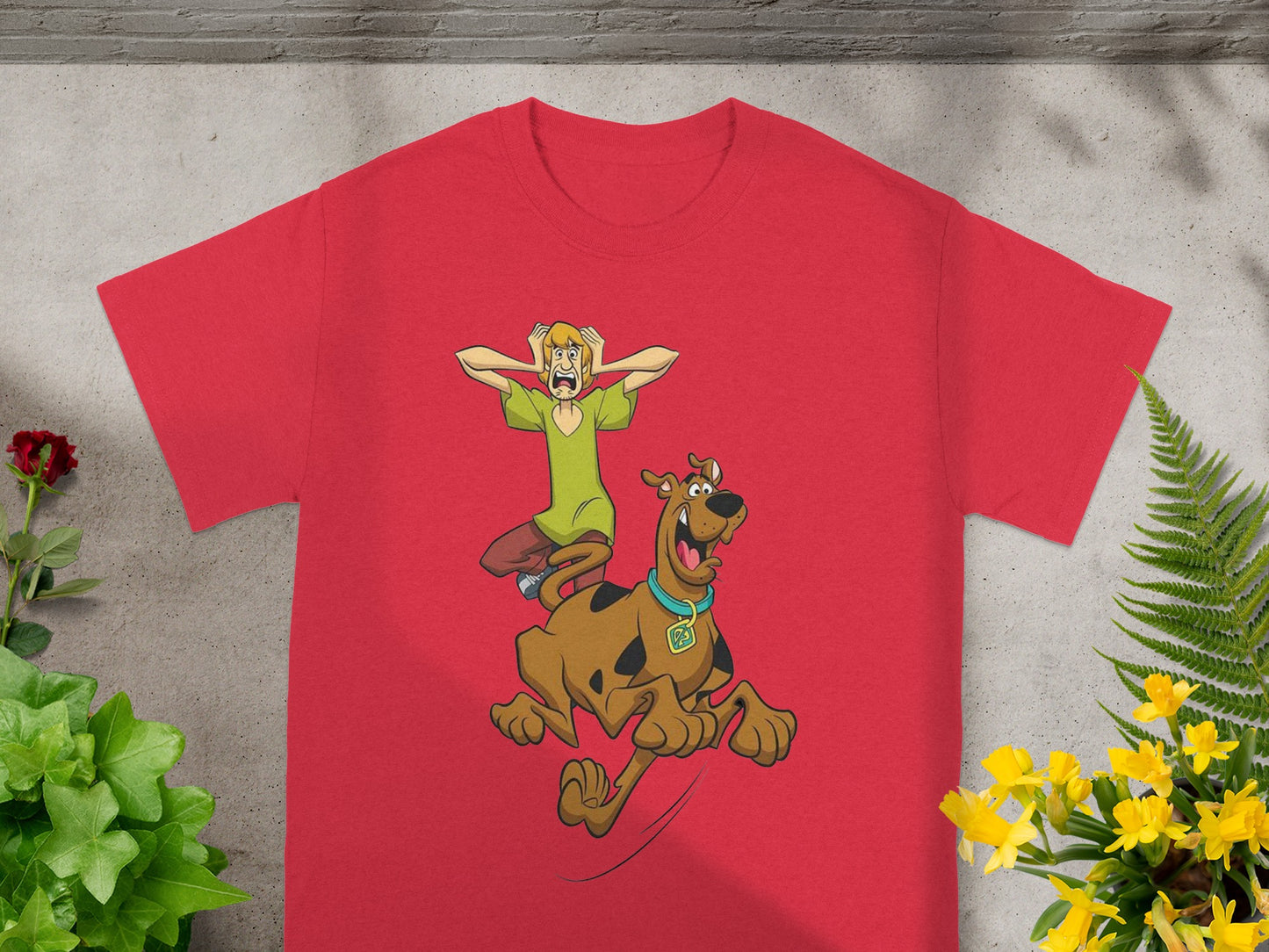 Scooby-Doo and Shaggy running scared on a red t-shirt.