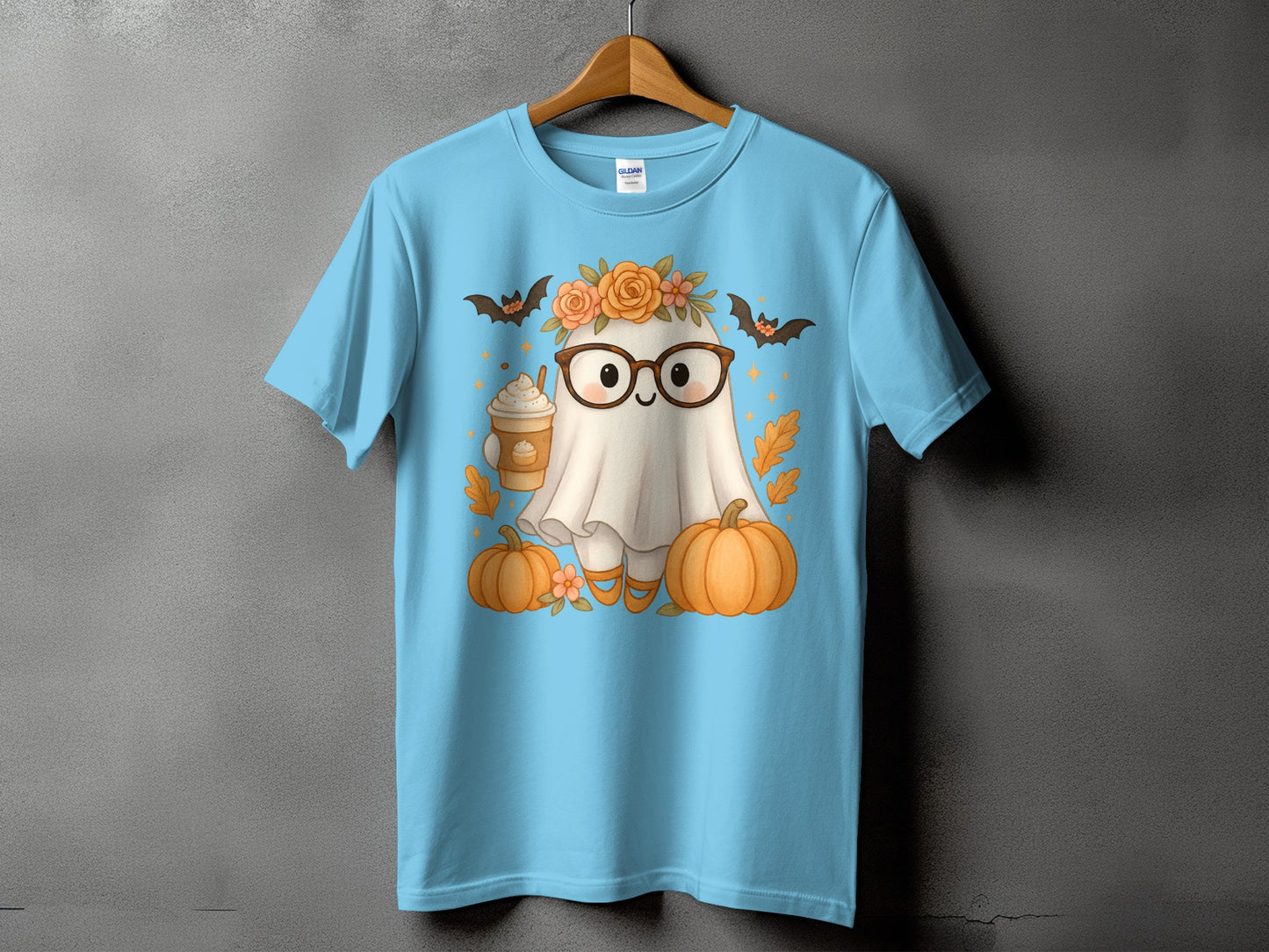Light blue t-shirt with a kawaii ghost wearing glasses and holding a pumpkin spice latte.