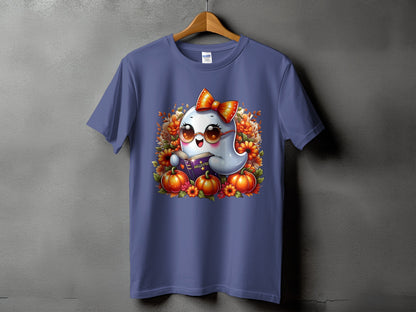 Ghost reading a Halloween book surrounded by pumpkins and flowers on a purple t-shirt.