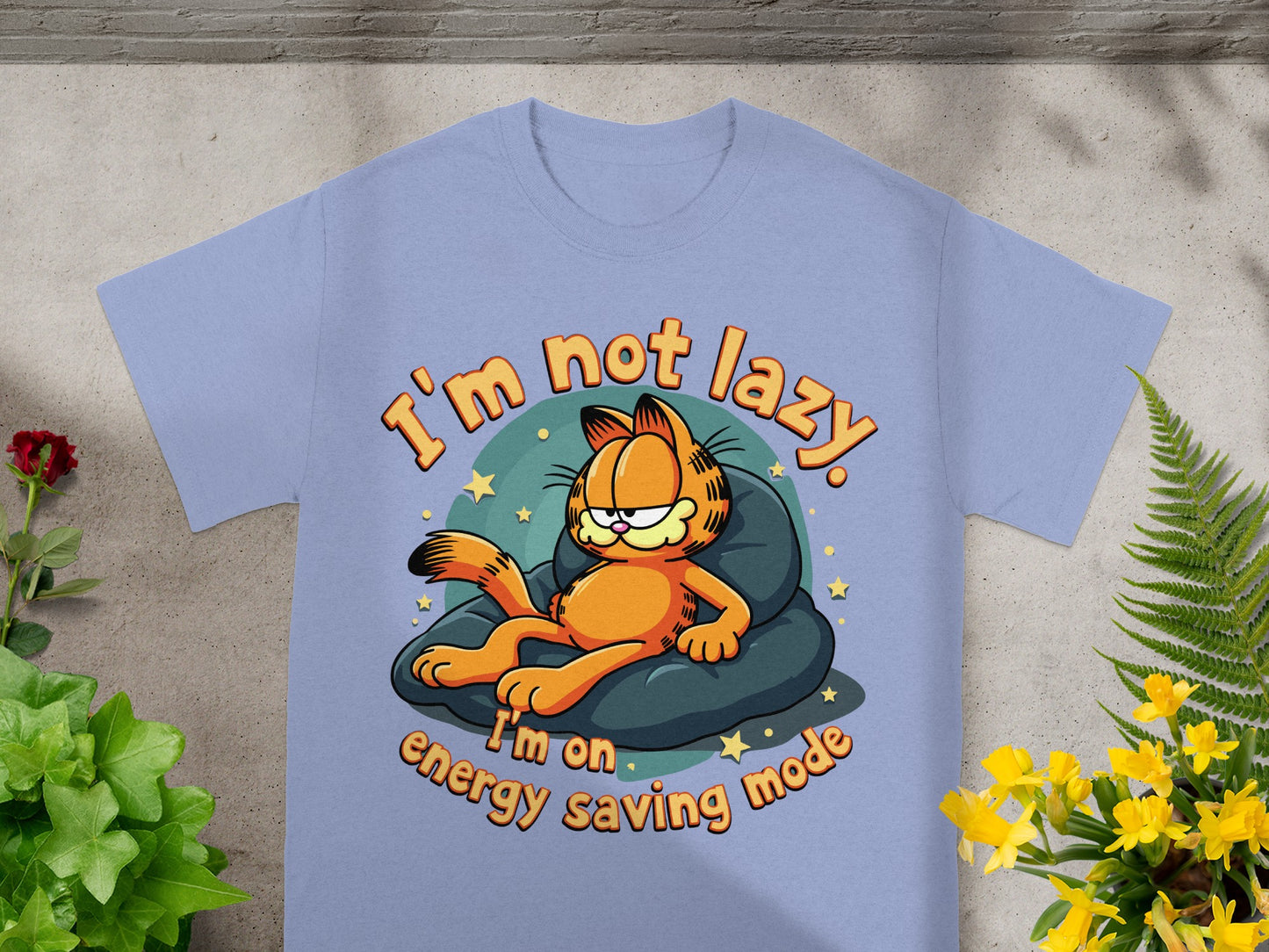 Light blue t-shirt with Garfield lounging on a beanbag, saying "I'm not lazy, I'm on energy saving mode."