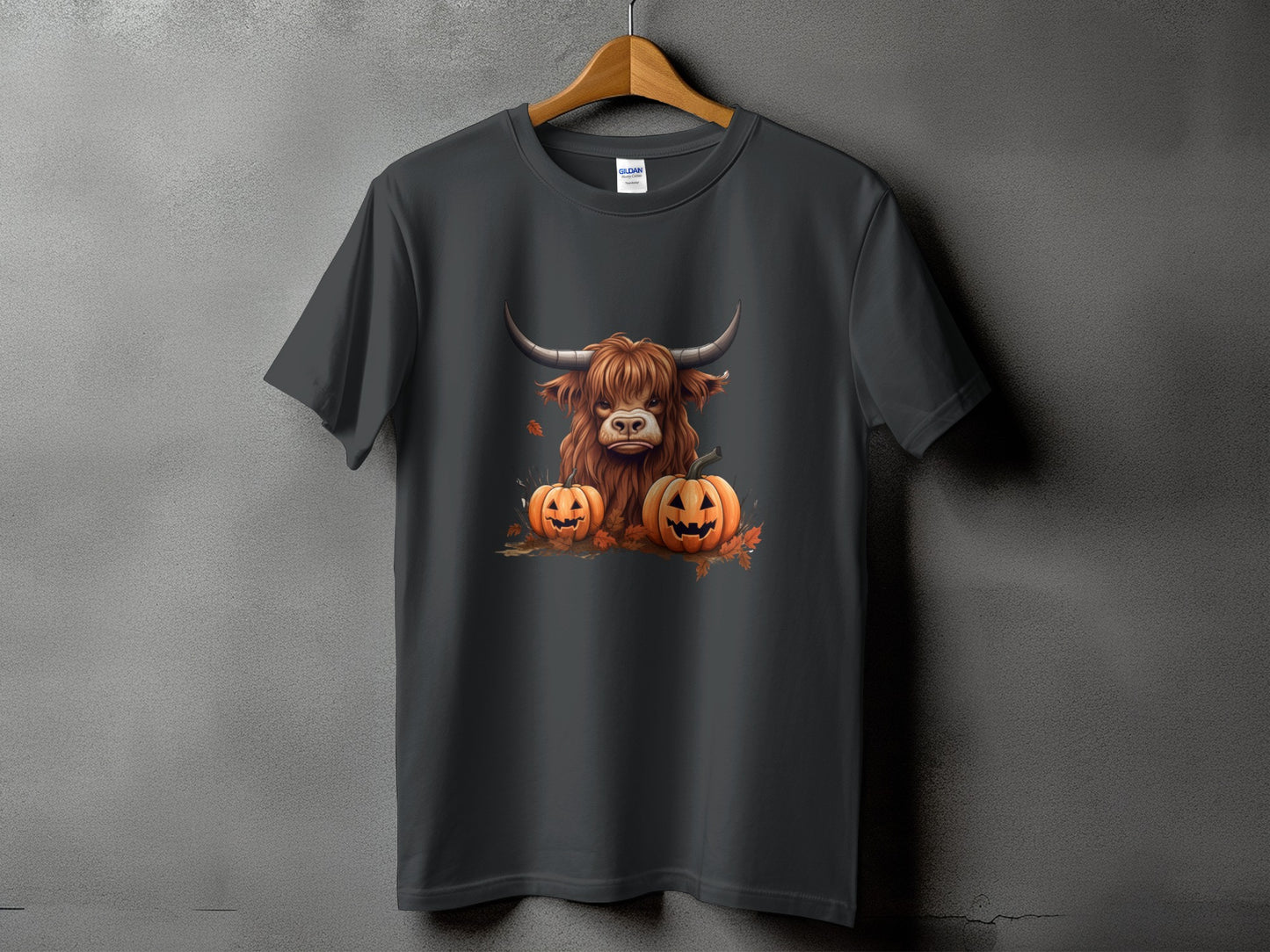 Dark grey t-shirt with a Highland cow and two jack-o'-lanterns graphic.