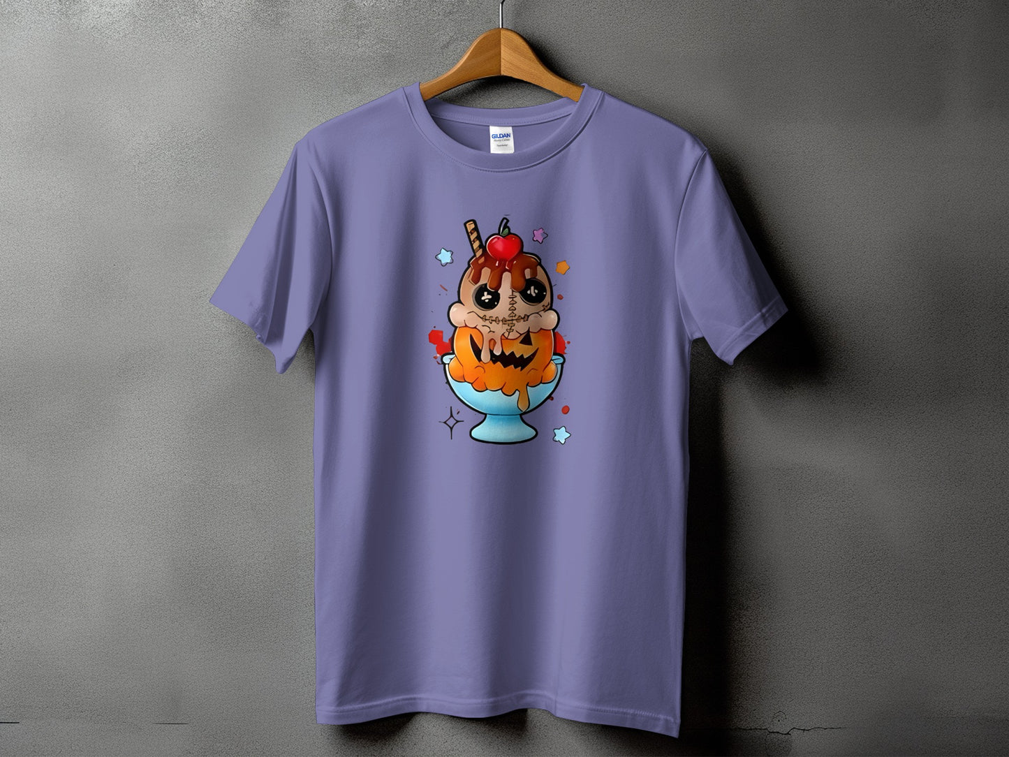 Purple t-shirt with a cartoon ice cream sundae with a pumpkin face and stitches design.